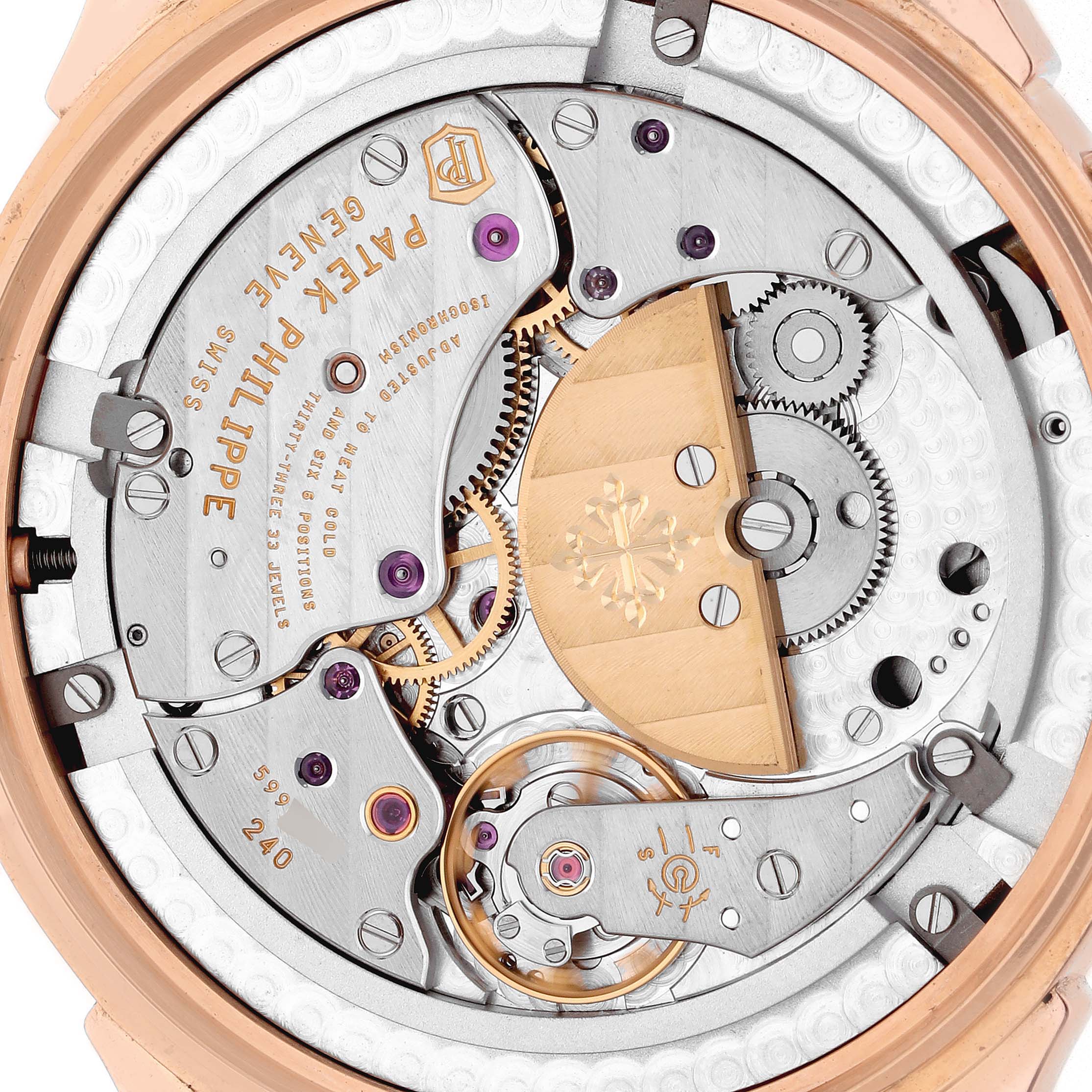 The Patek Philippe Complications 5230R-001 Men
s Rose Gold Grey Dial model is shown from the back, highlighting the intricate movement and rotor details.