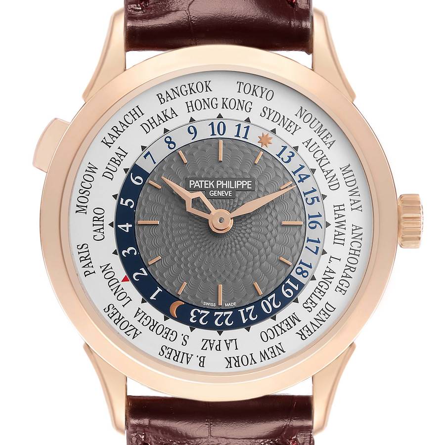 The image shows the Patek Philippe Complications watch, model number 5230R-001, from a front angle, highlighting its detailed dial and world time features.