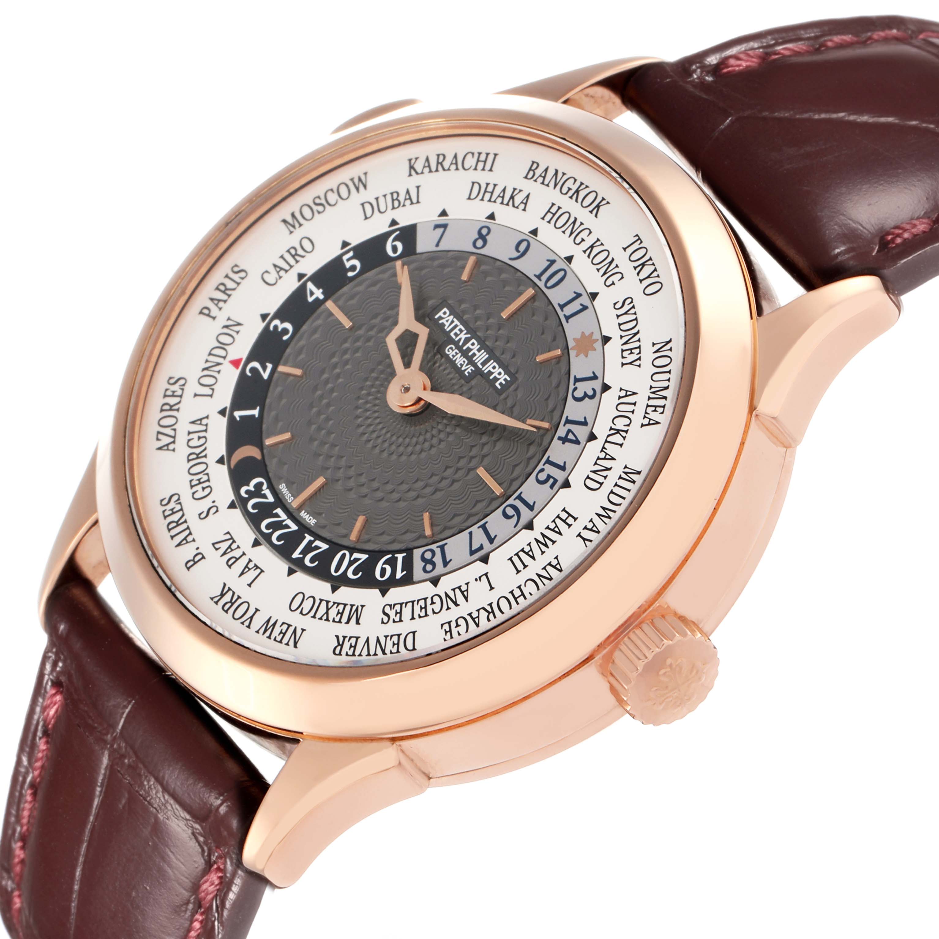 The Patek Philippe Complications 5230R-001 Men
s Rose Gold Grey Dial watch is shown at an angle highlighting the face, world time dial, and crown.