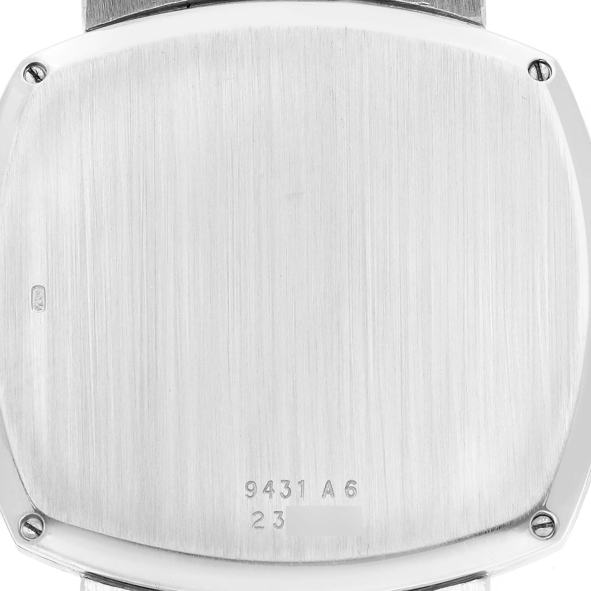 The image shows the back of the Piaget 9431A6 Women
s White Gold Silver Dial 9431A6 watch, featuring a brushed finish and engraved details.