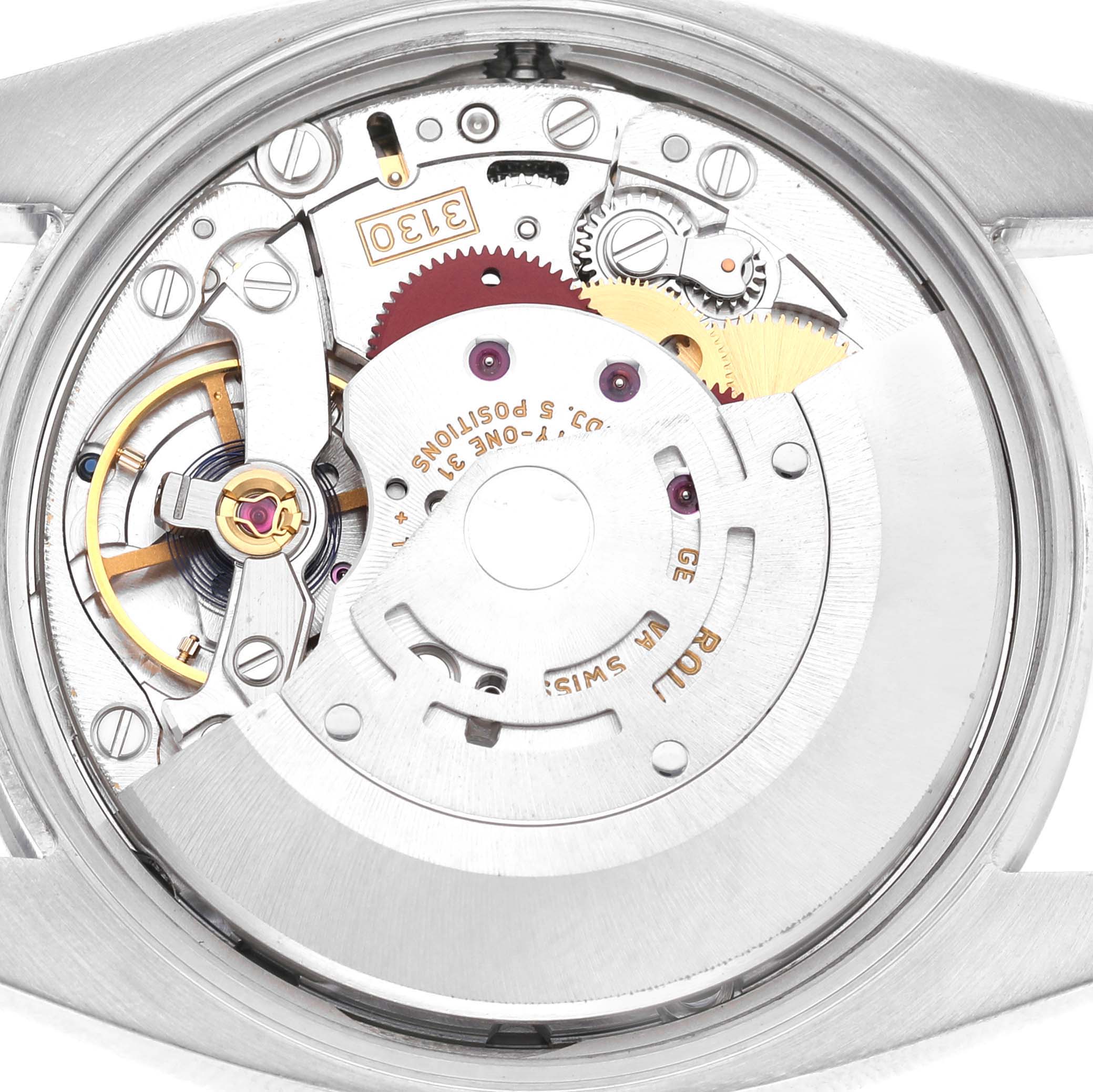 The image shows the movement of a Rolex Air-King 114200 Men's Stainless Steel Blue Dial watch, viewed from the back with visible gears and components.
