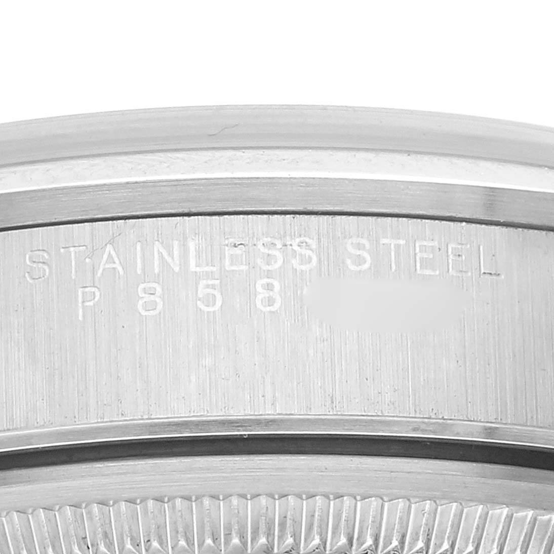 This image shows the side of the case back of a Rolex Air-King 14000 Men's Stainless Steel Silver Dial 14000 Men's Stainless Steel Silver Dial watch, highlighting the "Stainless Steel" engraving.