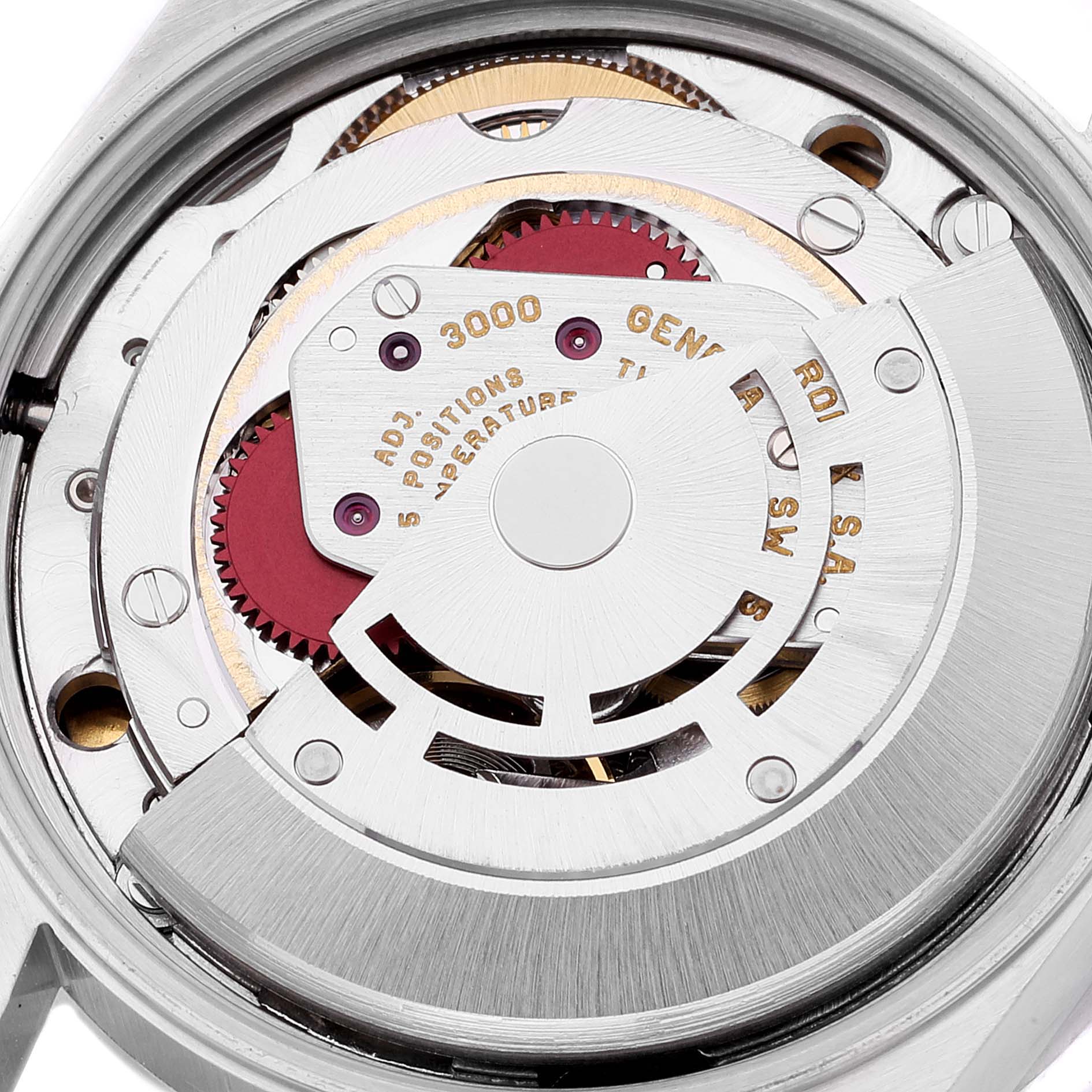 The image shows a close-up view of the movement of a Rolex Air-King 14010 Men's Stainless Steel White Dial 14010 Men's Stainless Steel White Dial watch, displaying intricate gears and mechanisms.