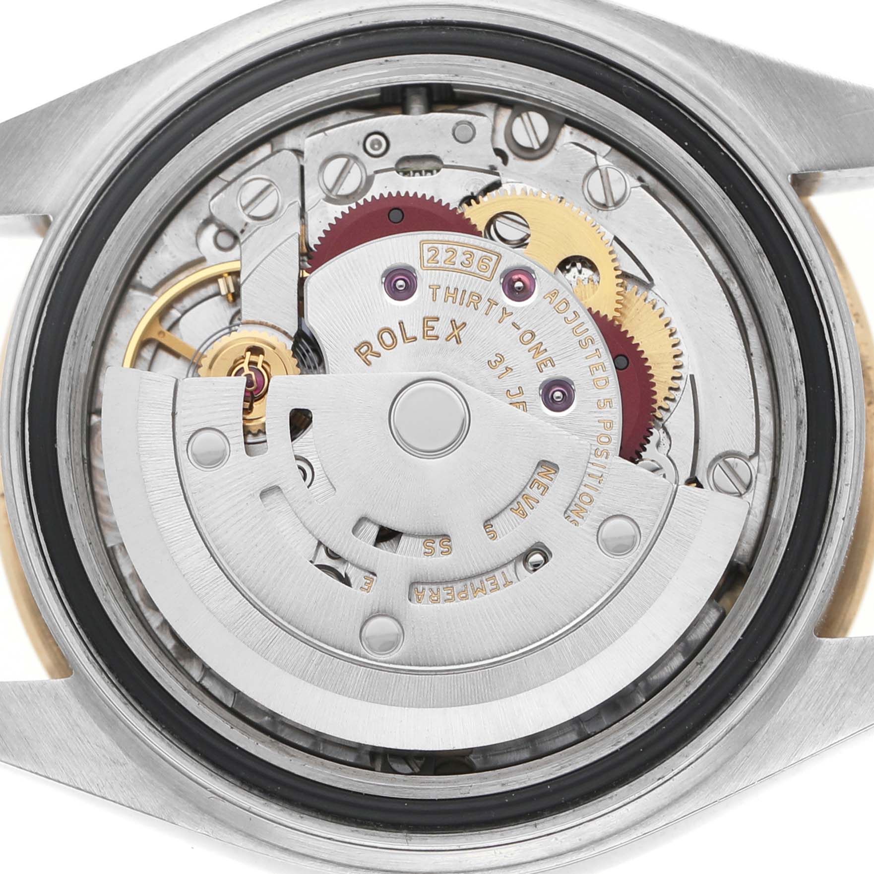 The image shows the internal movement of a Rolex Datejust 279173 Women's Steel and Gold (two tone) Champagne Dial watch from a top-down angle, highlighting the gears and rotor.