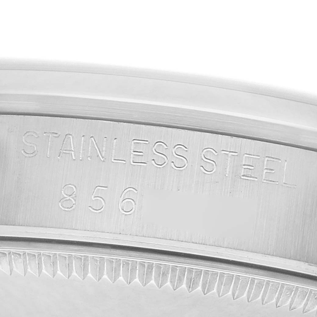 The image shows a close-up of the case side with "STAINLESS STEEL" engraved, highlighting the material of the Rolex Datejust 68240 Women
s Stainless Steel Silver Dial.