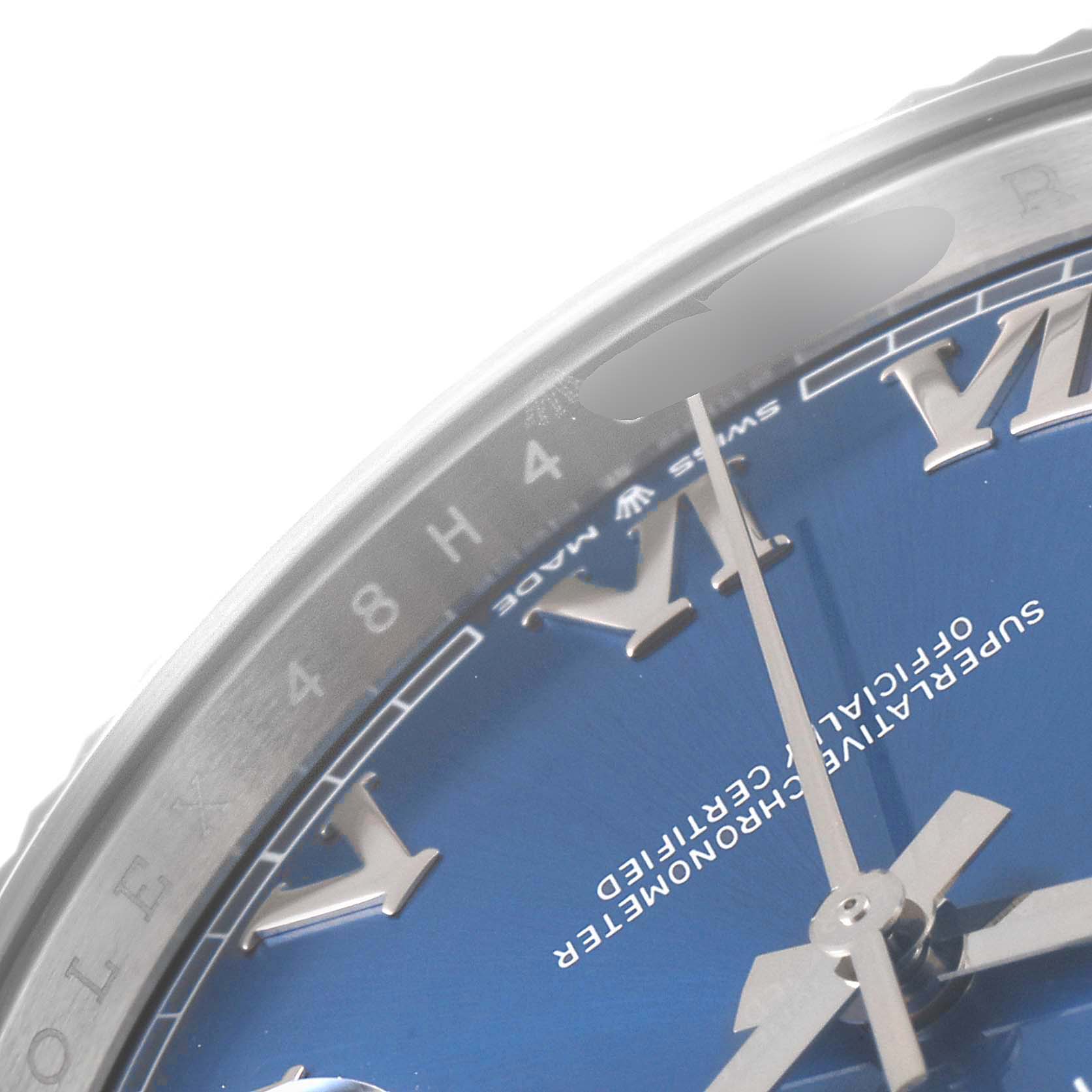 The image shows a close-up of a Rolex Datejust 41 126334 Men's Stainless Steel Blue Dial 126334 Men's Stainless Steel Blue Dial watch, highlighting part of the blue dial, Roman numeral markers, and the hour, minute, and second hands.