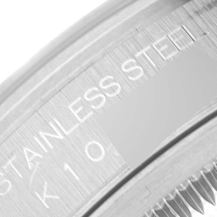 The image shows a close-up of the stainless steel casing of a Rolex Datejust 16200 Men's Stainless Steel Blue Dial 16200 Men's Stainless Steel Blue Dial watch, highlighting the engraved text.