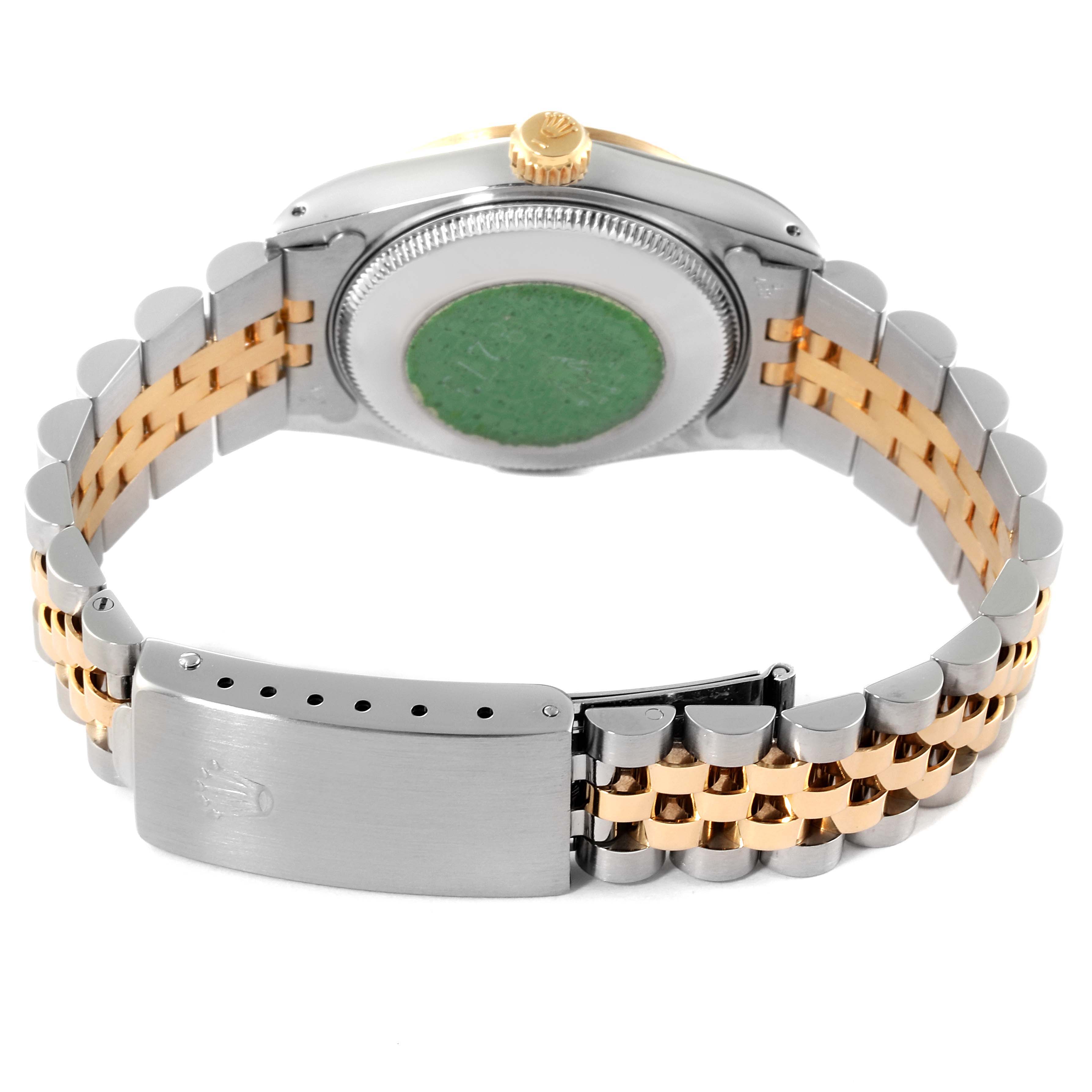 This image shows the back and bracelet clasp of a Rolex Mid-Size 68273 Women
s Steel and Gold (two tone) Champagne Dial 68273 Women
s Steel and Gold (two tone) Champagne Dial watch, highlighting its two-tone metal links.