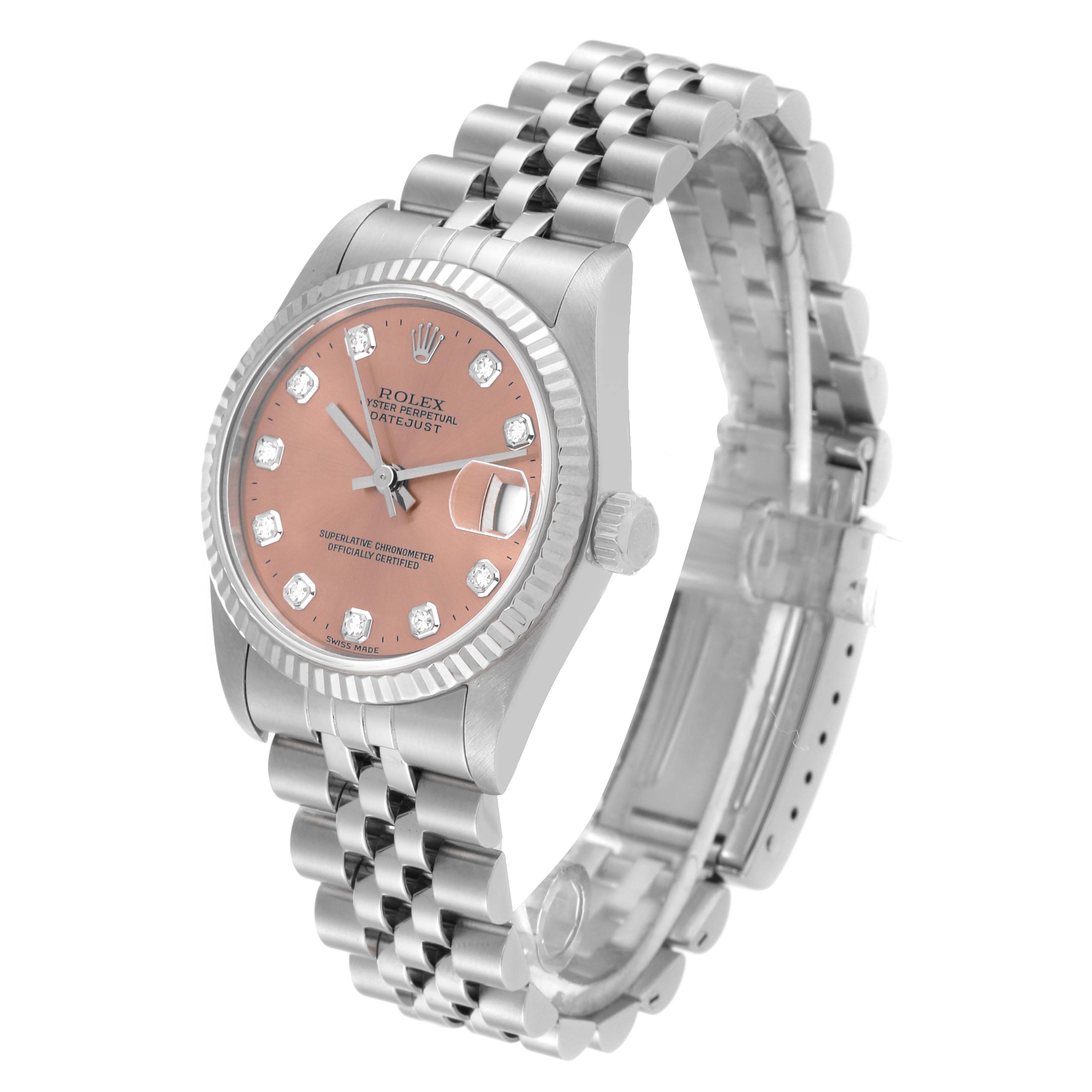 The watch is a Rolex Mid-Size 68274 Women's Stainless Steel Pink Dial 68274 Women's Stainless Steel Pink Dial model shown at an angle highlighting the face, bezel, crown, and bracelet.