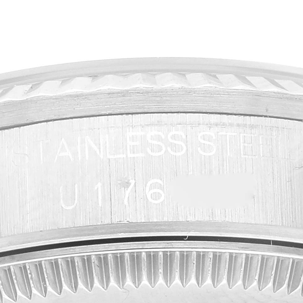 This image shows a close-up of the stainless steel back casing of a Rolex Mid-Size 68274 Women's Stainless Steel Pink Dial 68274 Women's Stainless Steel Pink Dial model watch, highlighting the serial number.
