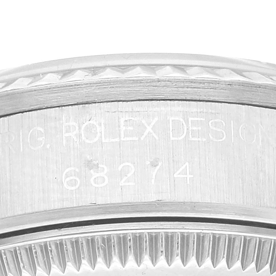 This image shows a close-up of the side, bezel, and model engraving (68274) of a Rolex Mid-Size 68274 Women's Stainless Steel Pink Dial 68274 Women's Stainless Steel Pink Dial watch.