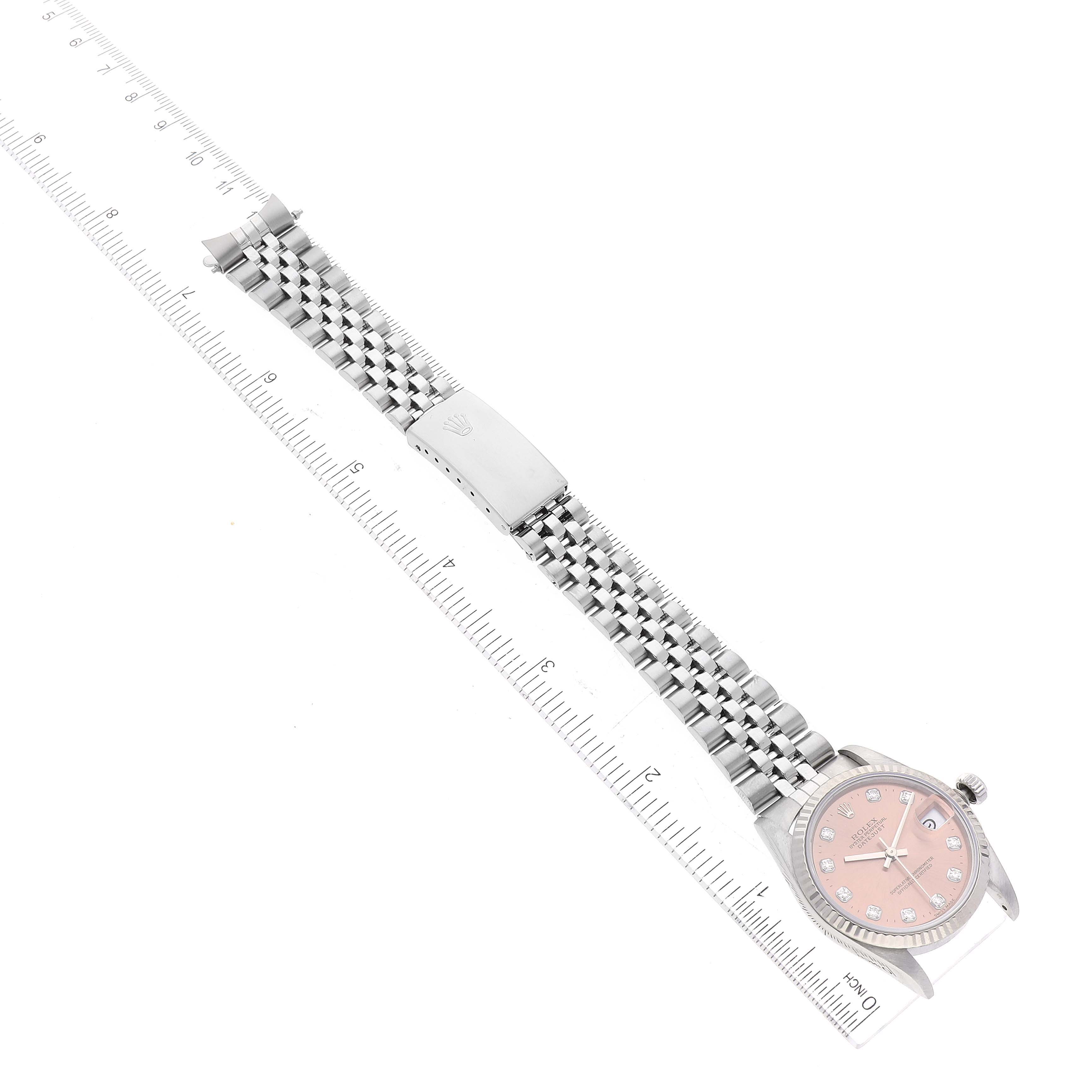 The Rolex Mid-Size 68274 Women's Stainless Steel Pink Dial 68274 Women's Stainless Steel Pink Dial watch is shown from a top-down angle, highlighting its face, bracelet, and clasp.