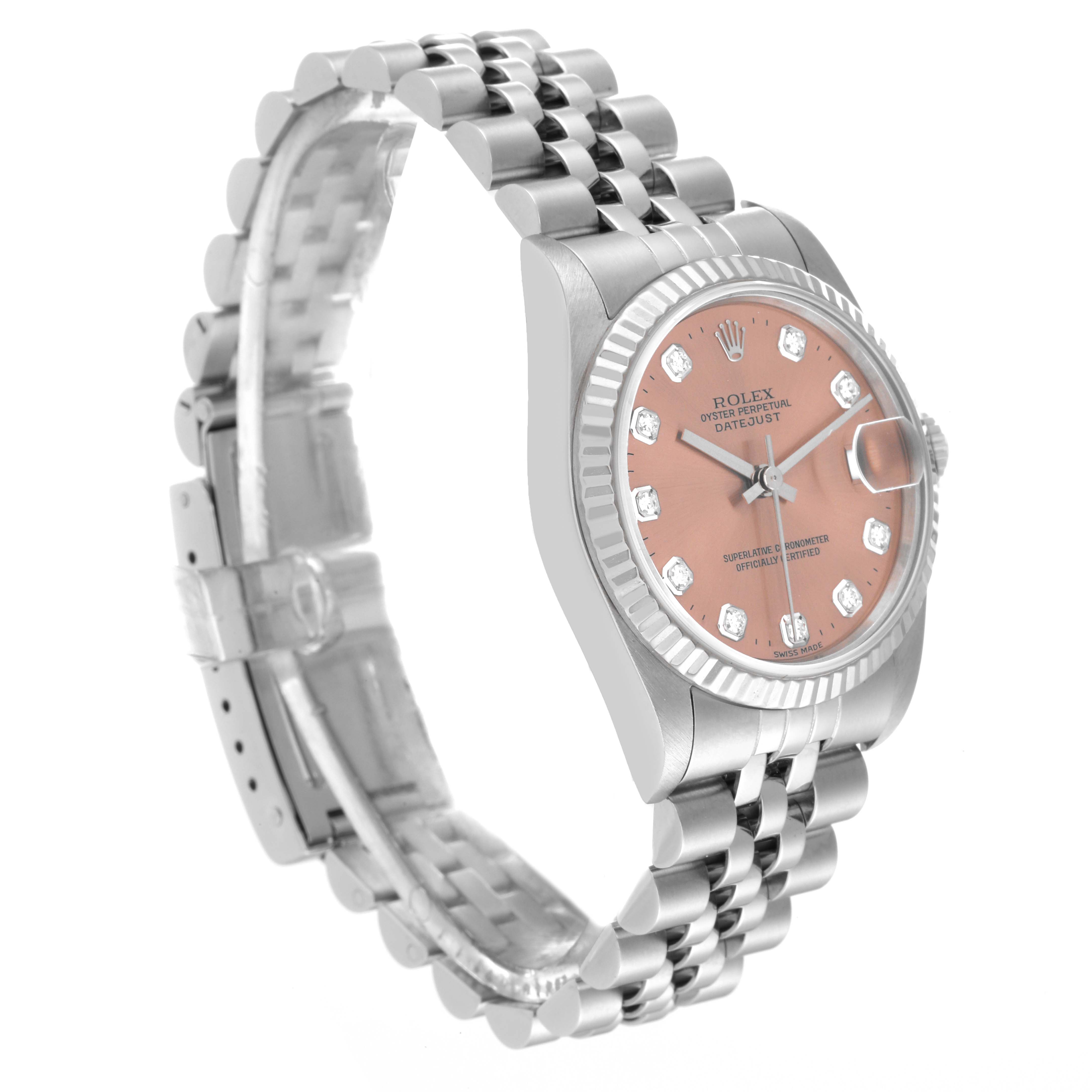 This image shows a Rolex Mid-Size 68274 Women's Stainless Steel Pink Dial 68274 Women's Stainless Steel Pink Dial Datejust watch from a three-quarter angle, highlighting its dial, bezel, and bracelet.