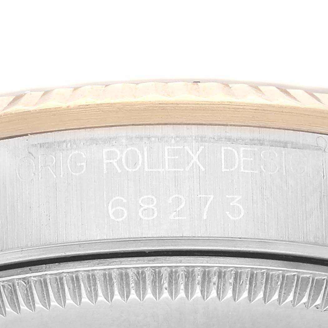 The image shows a close-up of the side of a Rolex Mid-Size 68273 Women's Steel and Gold (two tone) Champagne Dial 68273 Women's Steel and Gold (two tone) Champagne Dial model with the engraved design number 68273.