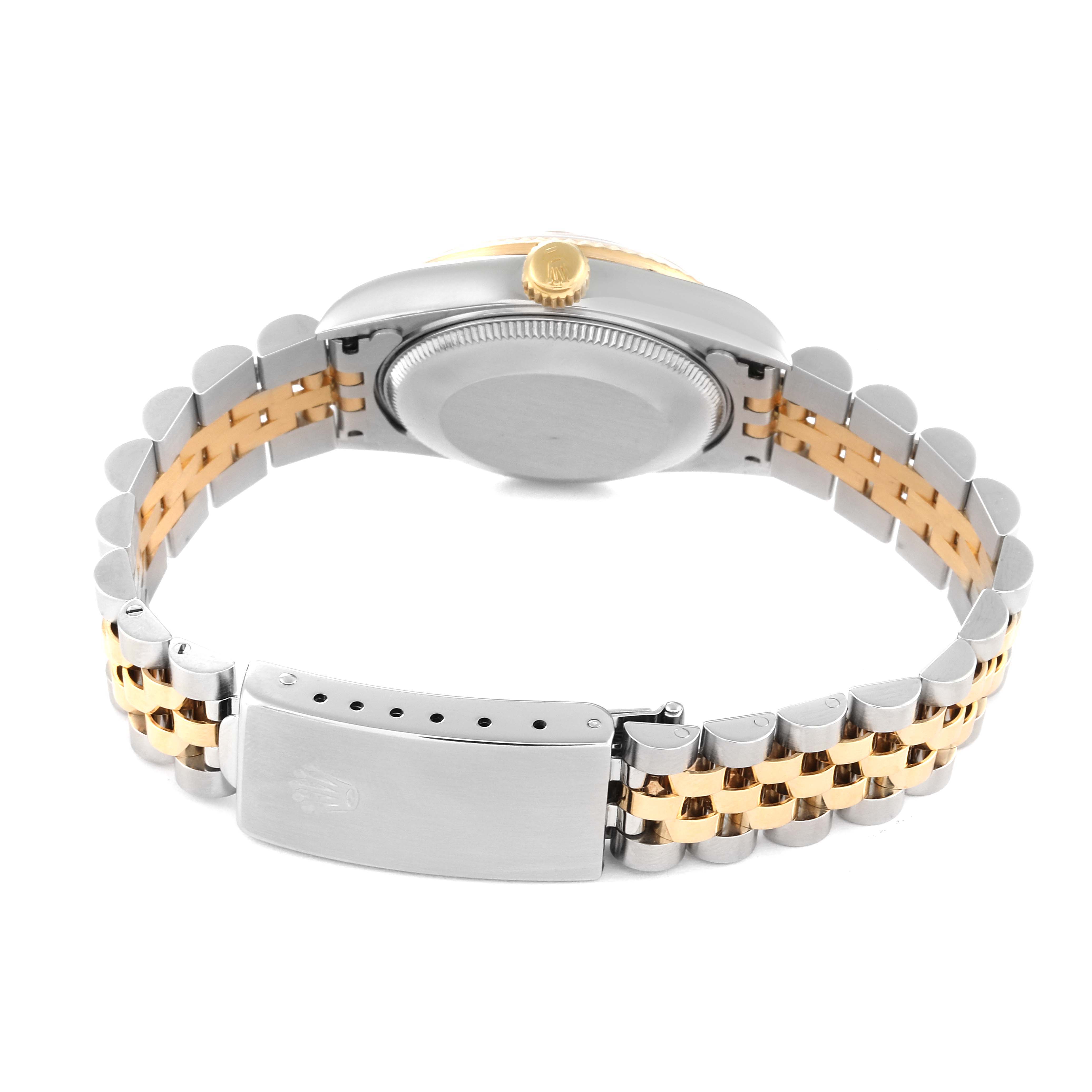 This image shows the back case and open clasp of a Rolex Mid-Size 68273 Women's Steel and Gold (two tone) Champagne Dial 68273 Women's Steel and Gold (two tone) Champagne Dial watch, highlighting its two-tone bracelet and crown.