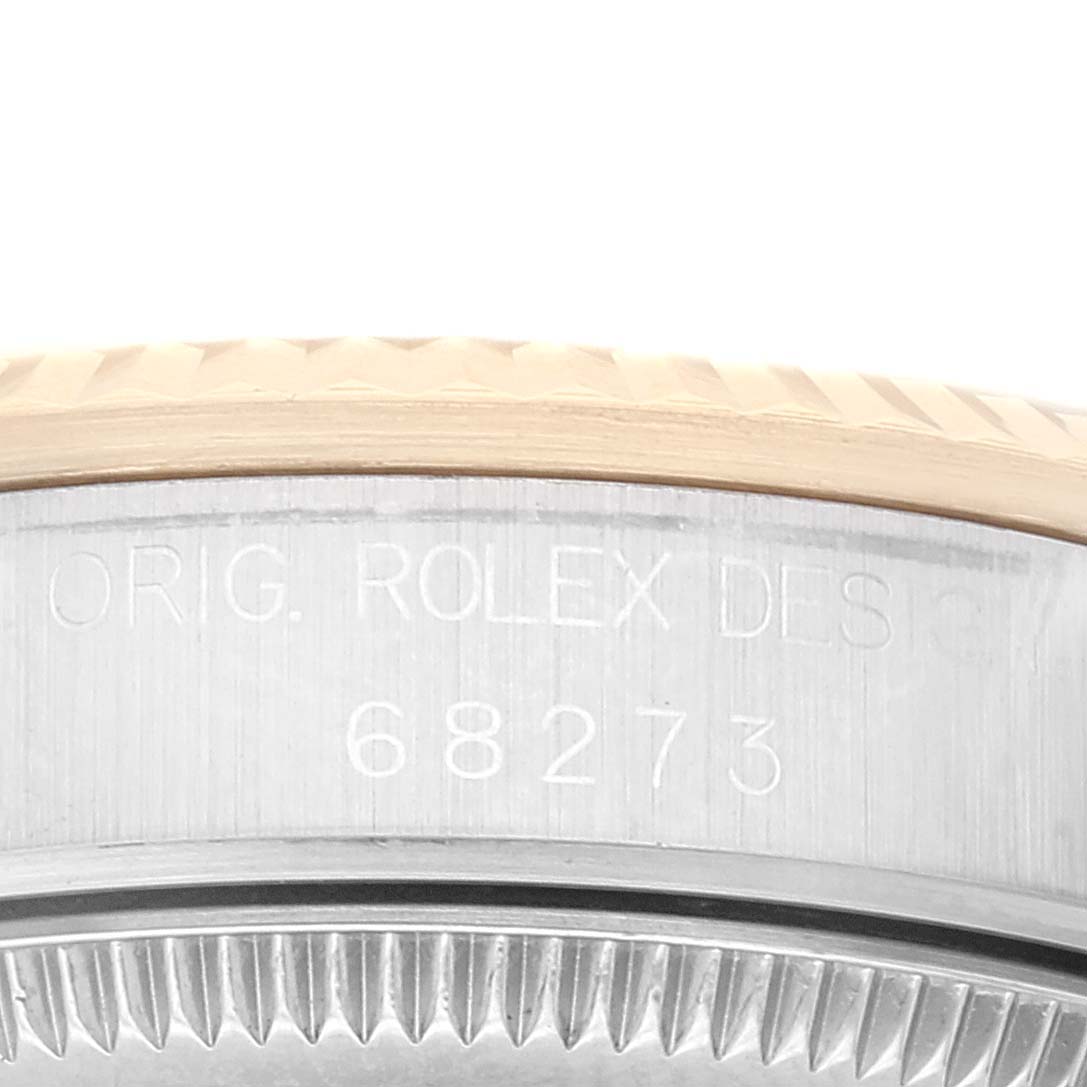 This close-up shows the side engraving on a Rolex Mid-Size 68273 Women's Steel and Gold (two tone) Champagne Dial 68273 Women's Steel and Gold (two tone) Champagne Dial model, highlighting the model number "68273."