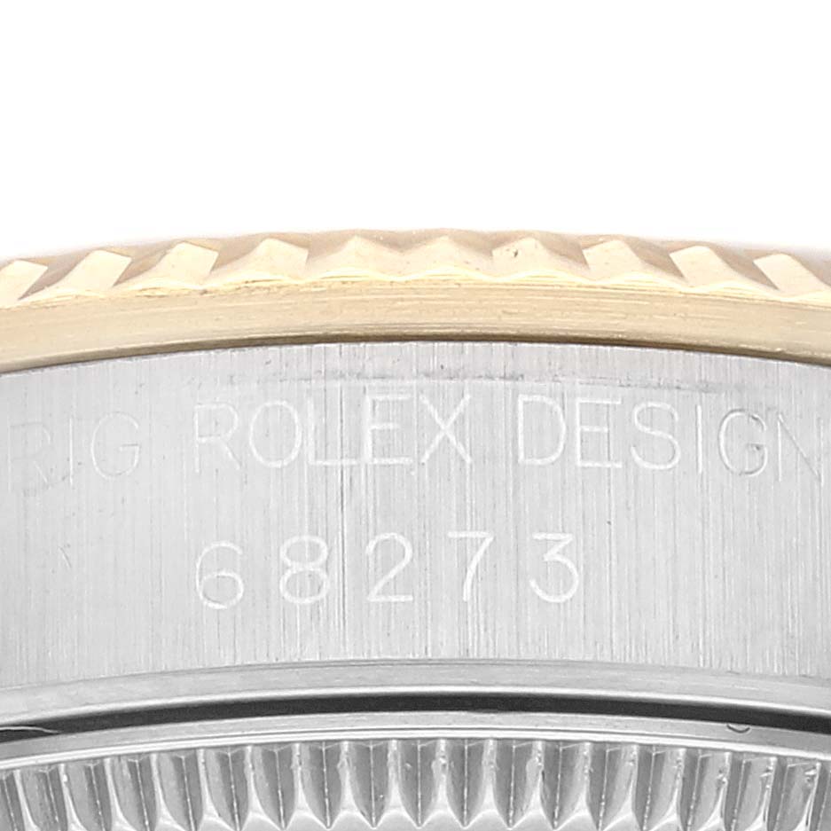 The image shows a close-up of the bezel and case side of a mid-size Rolex model 68273.