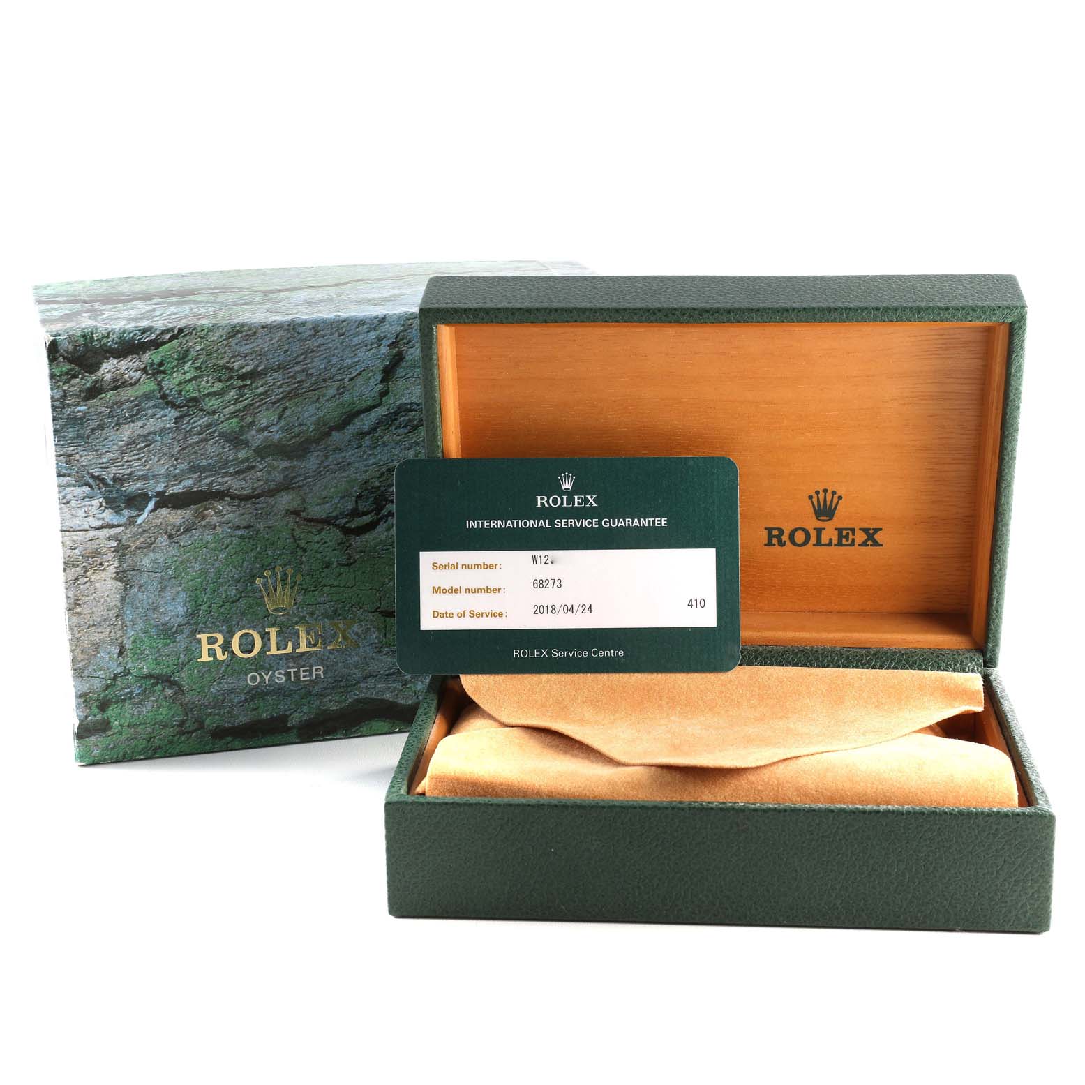 The Rolex Mid-Size 68273 Women's Steel and Gold (two tone) White Dial 68273 Women's Steel and Gold (two tone) White Dial watch accessories shown include an open box, a guarantee card, and a cardboard cover.