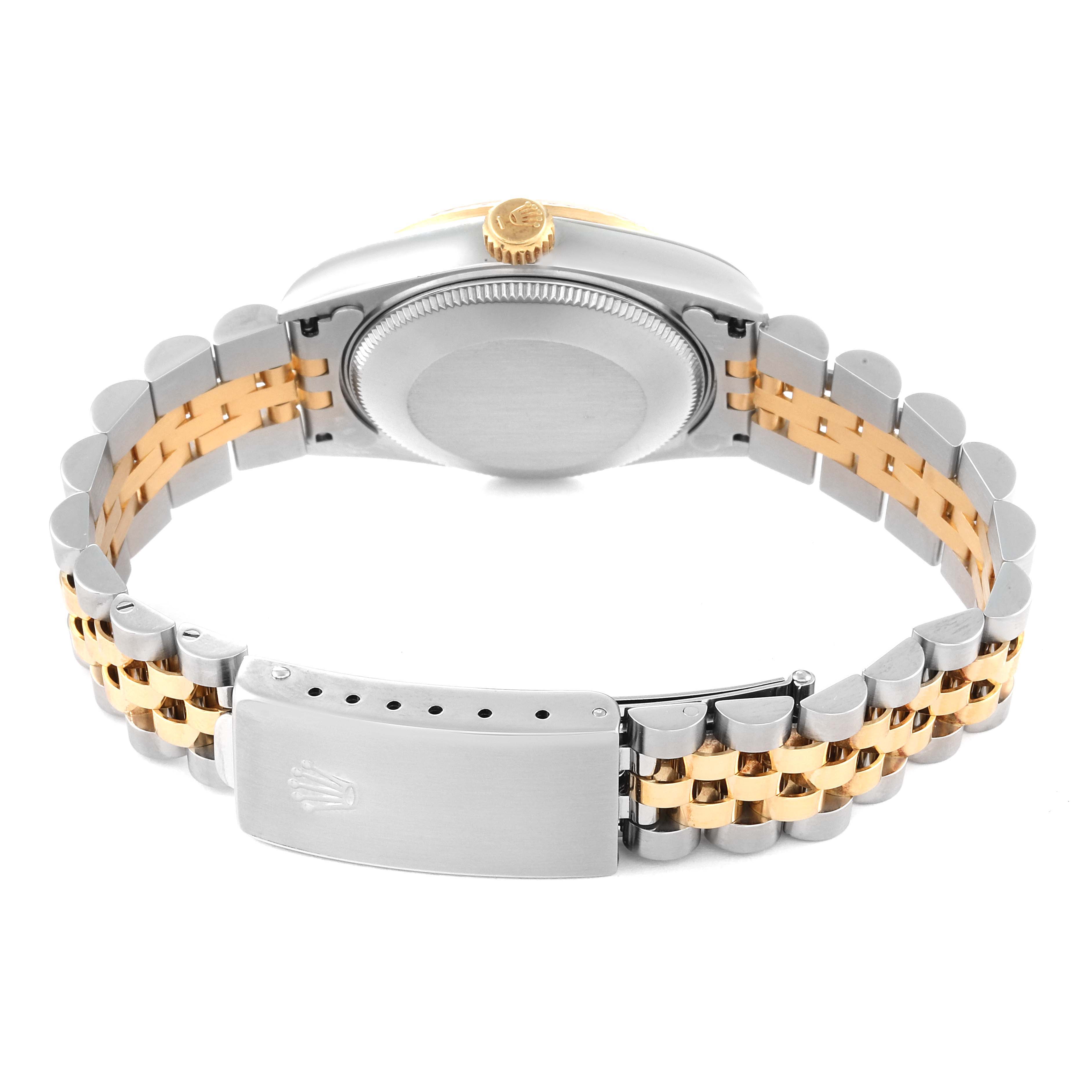 The image shows the backside and clasp of a Rolex Mid-Size 68273 Women's Steel and Gold (two tone) Champagne Dial 68273 Women's Steel and Gold (two tone) Champagne Dial model watch, emphasizing its two-tone bracelet and case back.