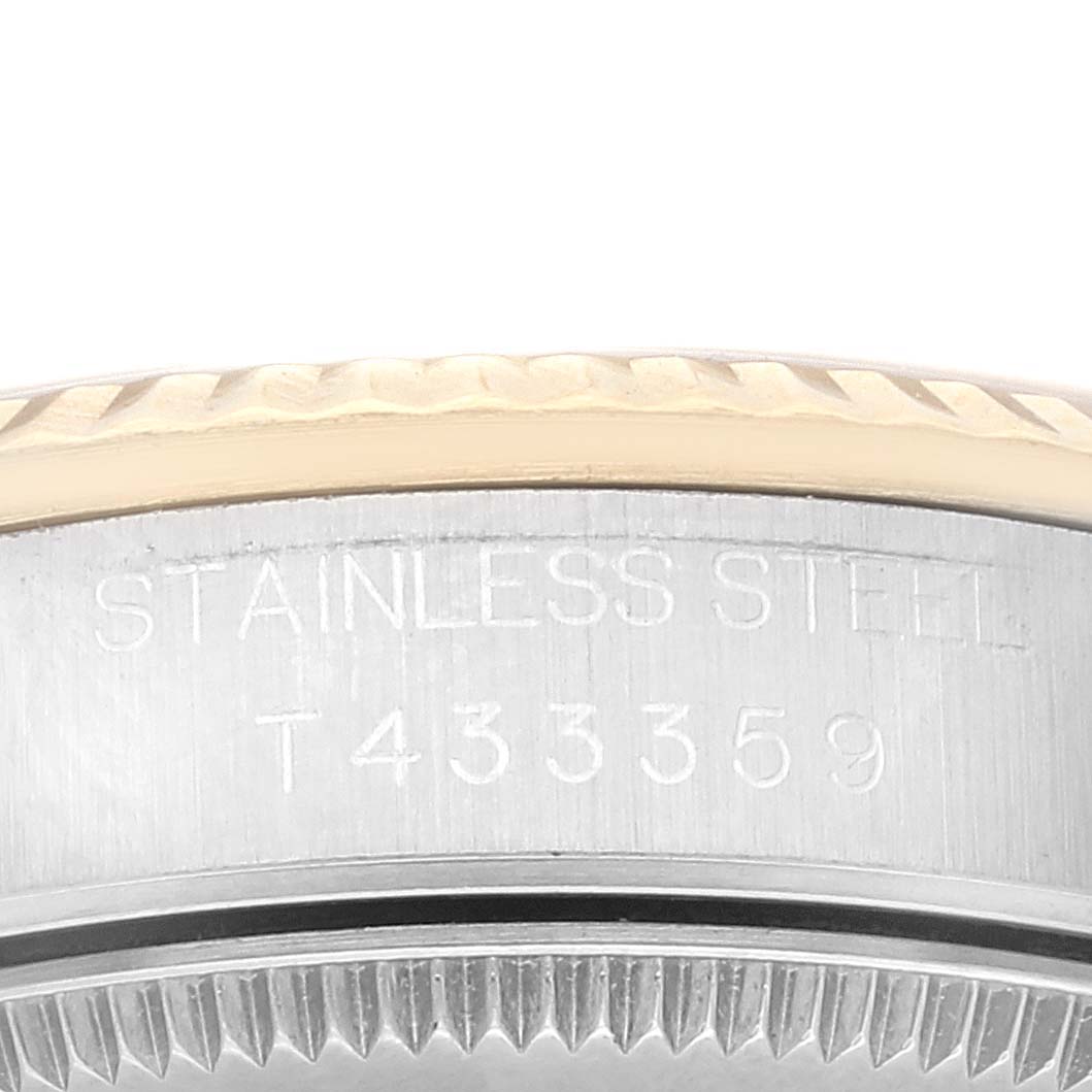This image shows a close-up of the serial number and "Stainless Steel" engraving on the case of the Rolex Mid-Size 68273 Women's Steel and Gold (two tone) Champagne Dial 68273 Women's Steel and Gold (two tone) Champagne Dial watch.