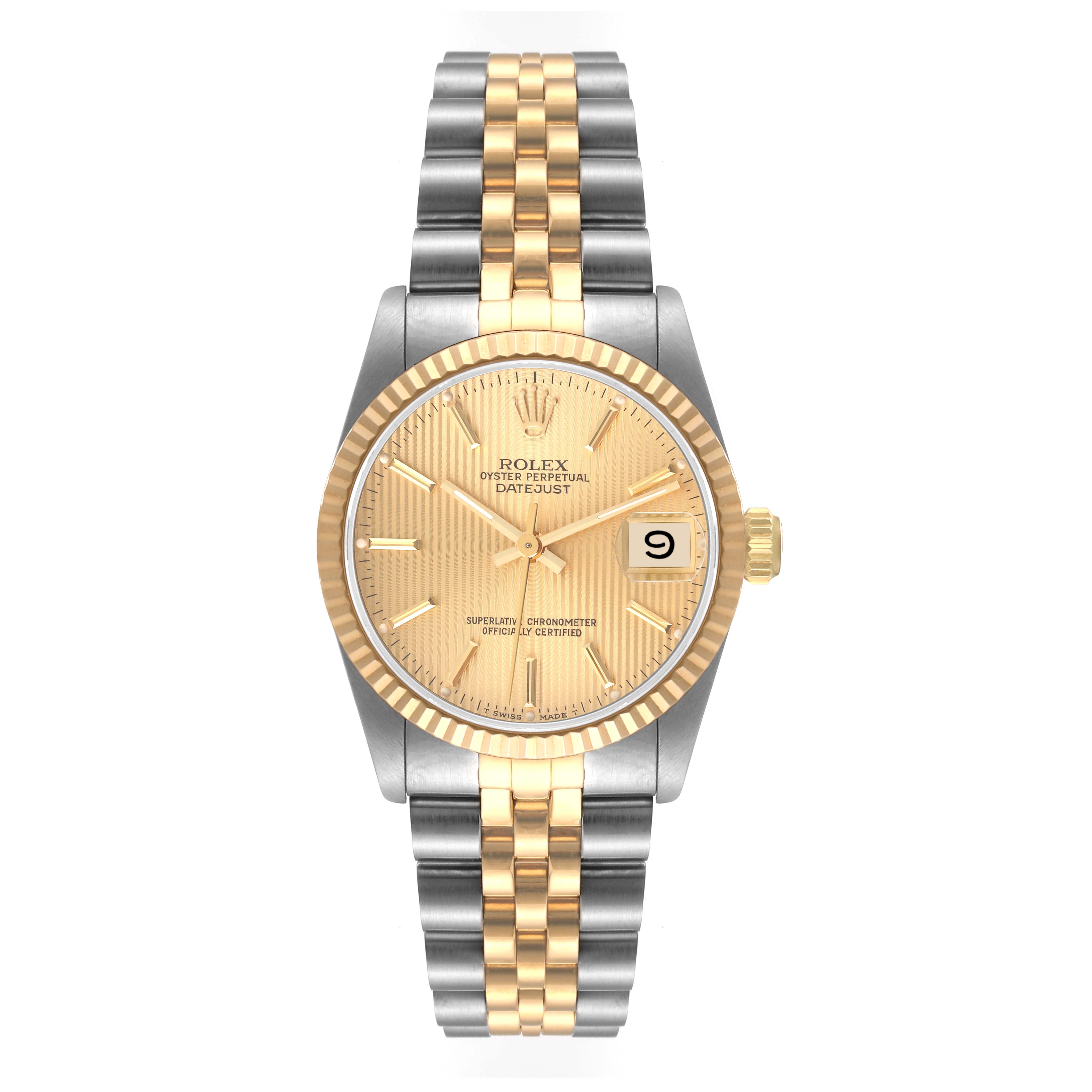 This Mid-Size Rolex watch is shown from a top-down angle, highlighting the gold and silver bracelet, fluted bezel, and date display.