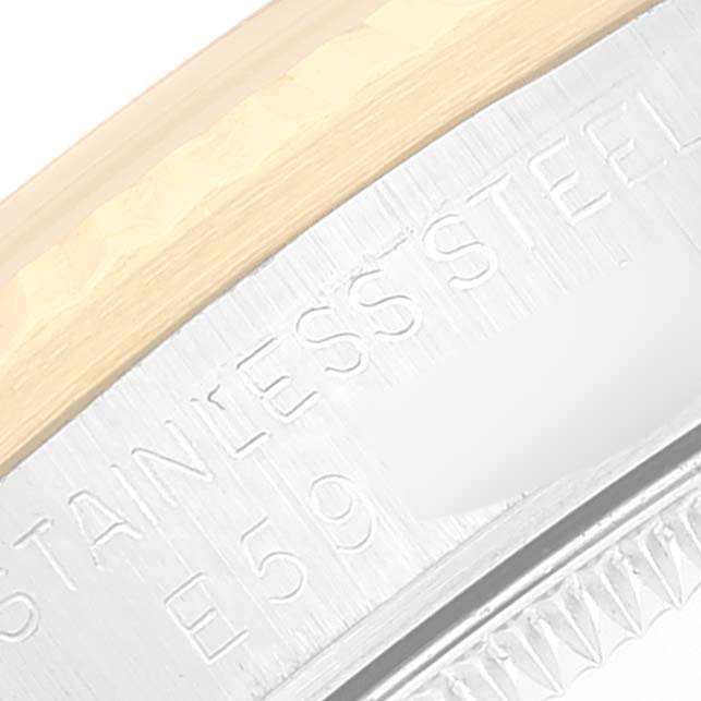 This close-up image shows the side of a Mid-Size Rolex watch case, highlighting its stainless steel and gold components.