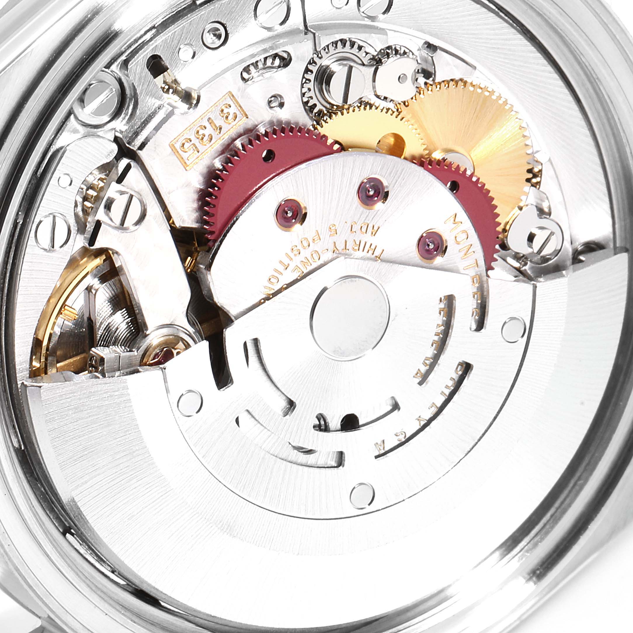 This image shows the intricate internal movement of a Rolex Datejust 16220 Men's Stainless Steel Silver Dial 16220 Men's Stainless Steel Silver Dial watch, focusing on the gears and mechanical components.