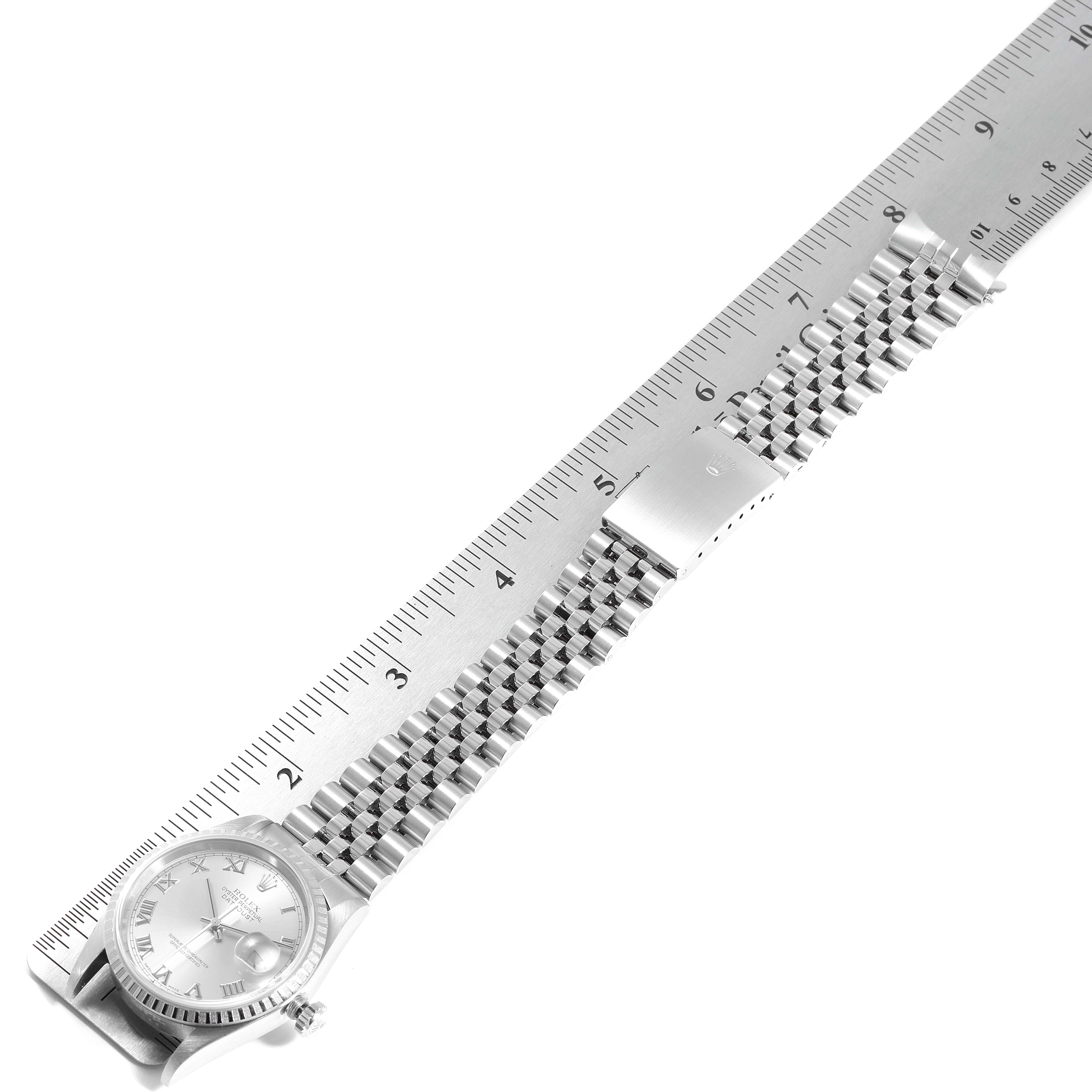 The image shows a Rolex Datejust 16220 Men's Stainless Steel Silver Dial 16220 Men's Stainless Steel Silver Dial watch laid flat with a ruler, displaying the face and bracelet.