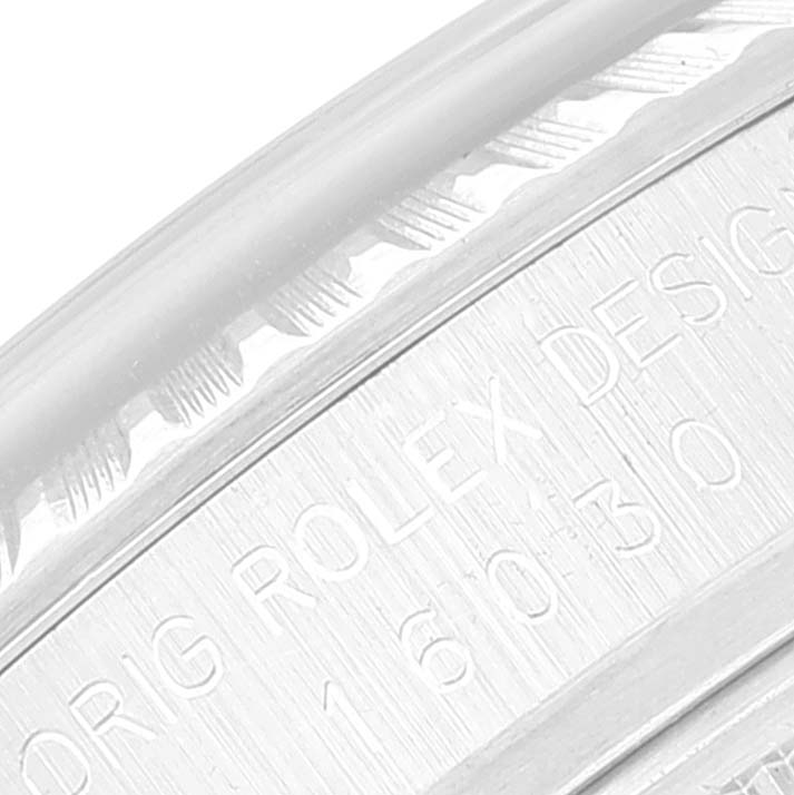This image shows a close-up of an engraving on the bezel of a Rolex Vintage Collection 16030 Men's Stainless Steel Silver Dial 16030 Men's Stainless Steel Silver Dial watch.