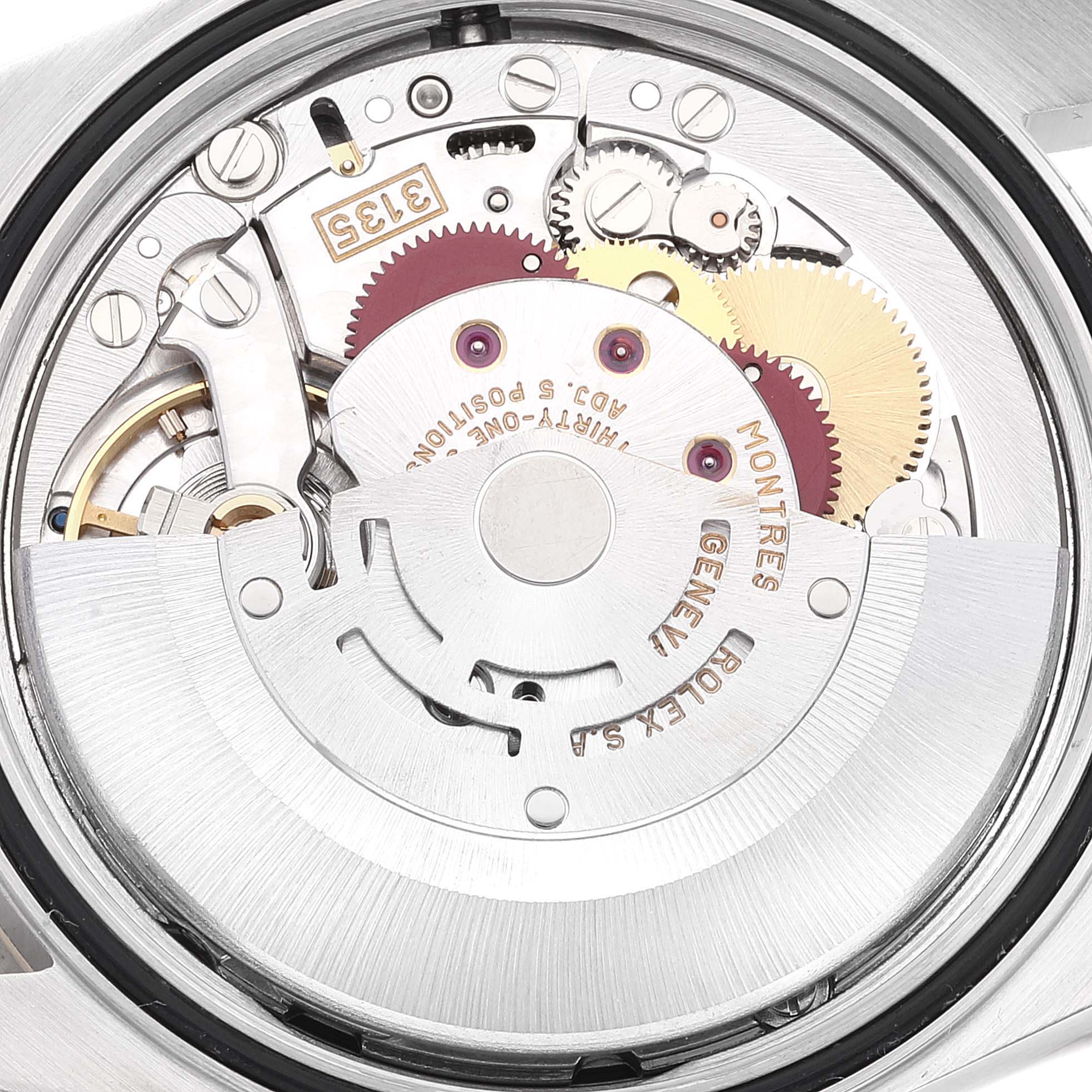 This image shows the inner mechanism of a Rolex Datejust 16233 Men's Steel and Gold (two tone)  16233 Men's Steel and Gold (two tone)  watch, focusing on the automatic movement components.