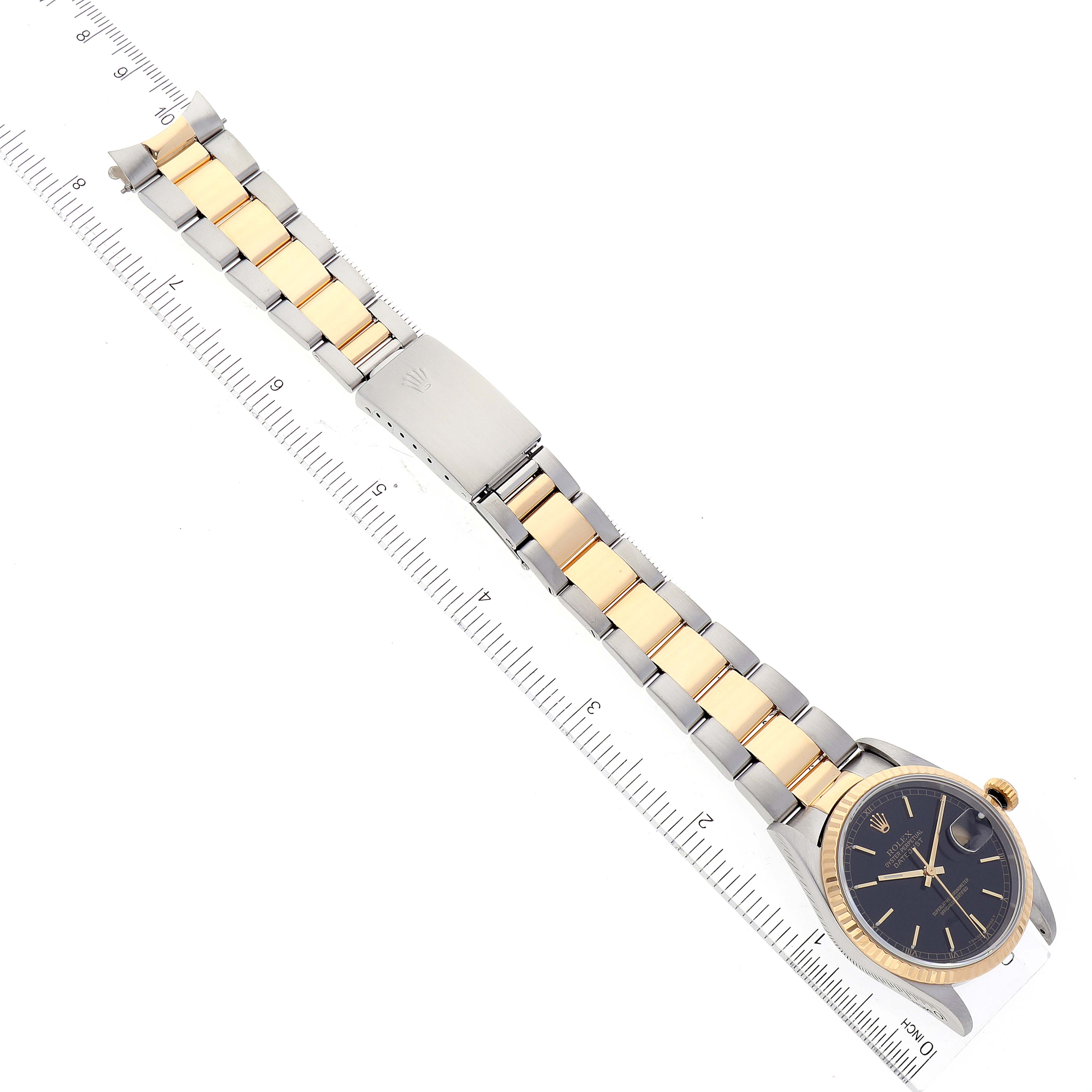 The image shows a Rolex Datejust 16233 Men's Steel and Gold (two tone)  16233 Men's Steel and Gold (two tone)  watch laid flat with the dial, bracelet, and clasp visible alongside a ruler for measurement.