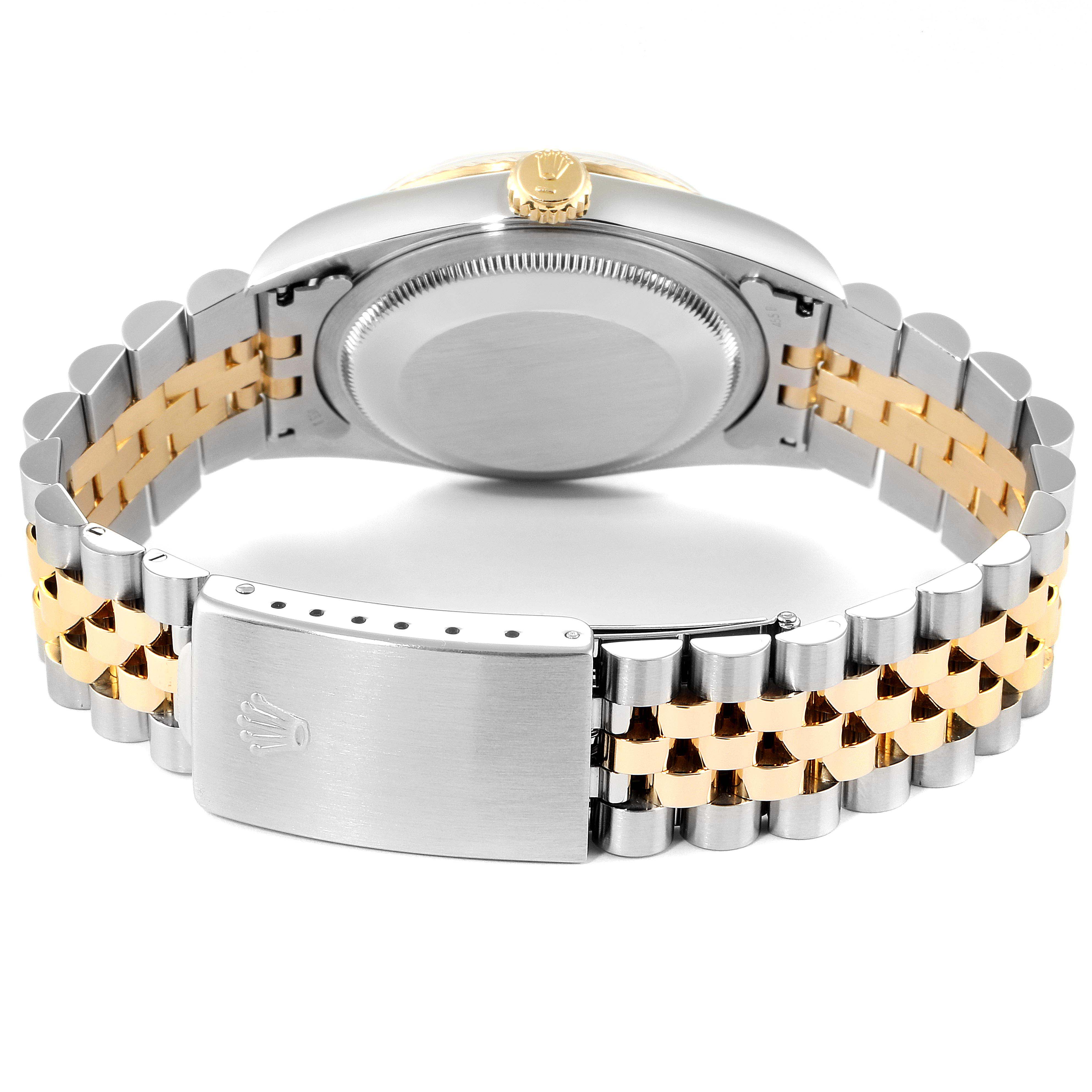 The image shows the back case and bracelet clasp of a Rolex Datejust 16233 Men
s Steel and Gold (two tone) Champagne Dial 16233 Men
s Steel and Gold (two tone) Champagne Dial watch, including its two-tone metal link design.