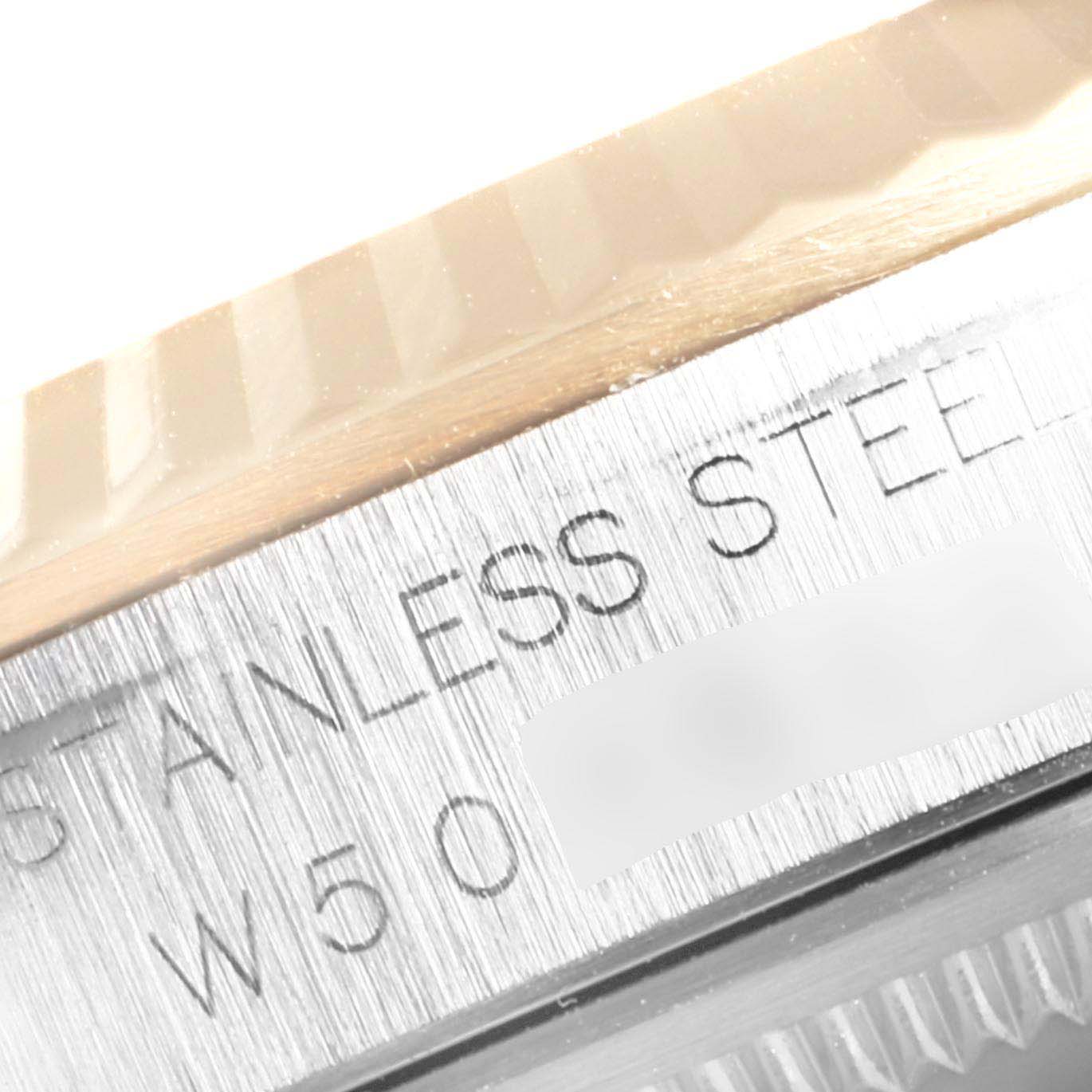 The image shows a close-up of the bezel and part of the case back of a Rolex Datejust 16233 Men
s Steel and Gold (two tone) Champagne Dial 16233 Men
s Steel and Gold (two tone) Champagne Dial, highlighting the "Stainless Steel" marking.