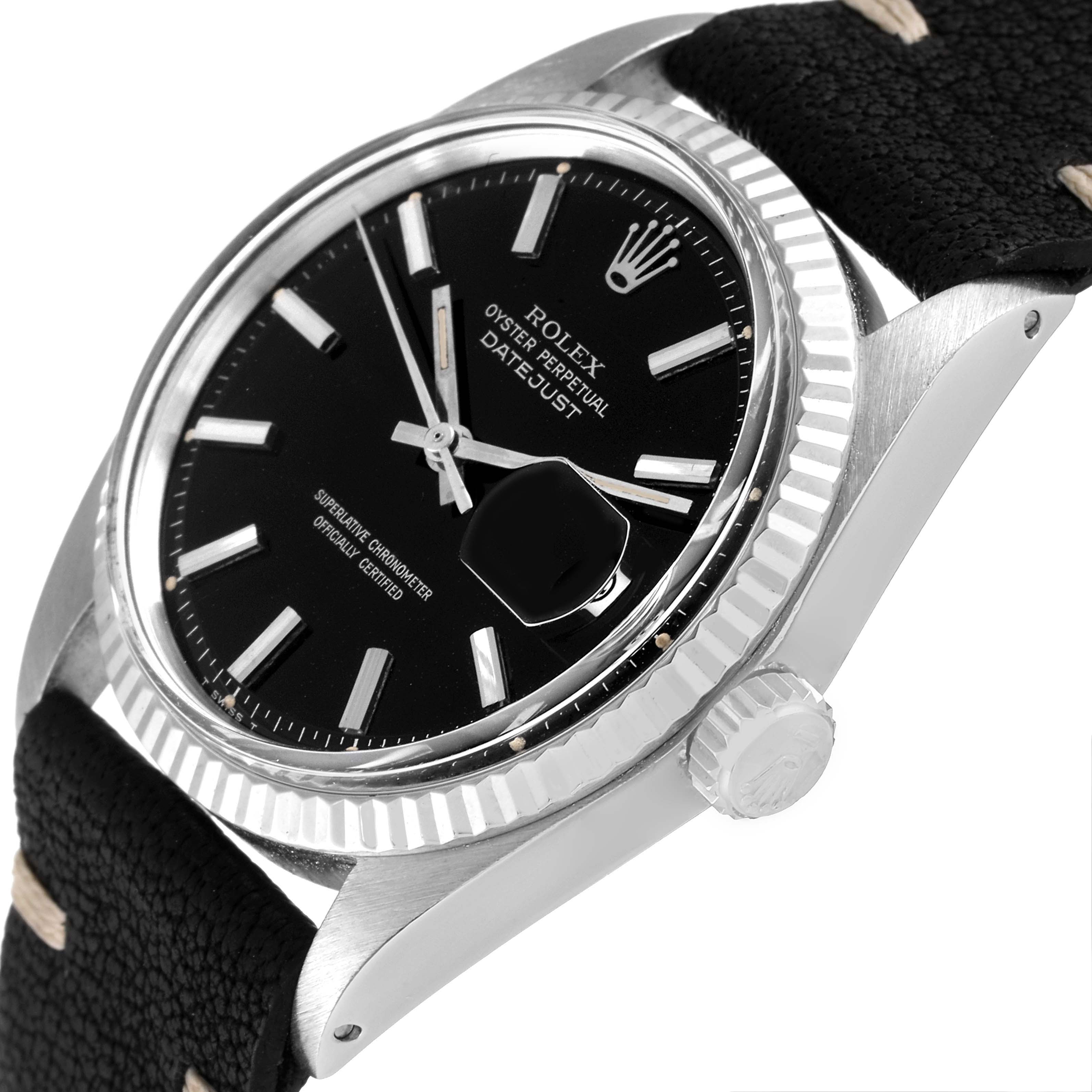 This image shows a close-up of the Rolex Vintage Collection 1601 Men's Stainless Steel Black Dial 1601 Men's Stainless Steel Black Dial Datejust watch, including its black dial, fluted bezel, and crown, viewed at an angle.