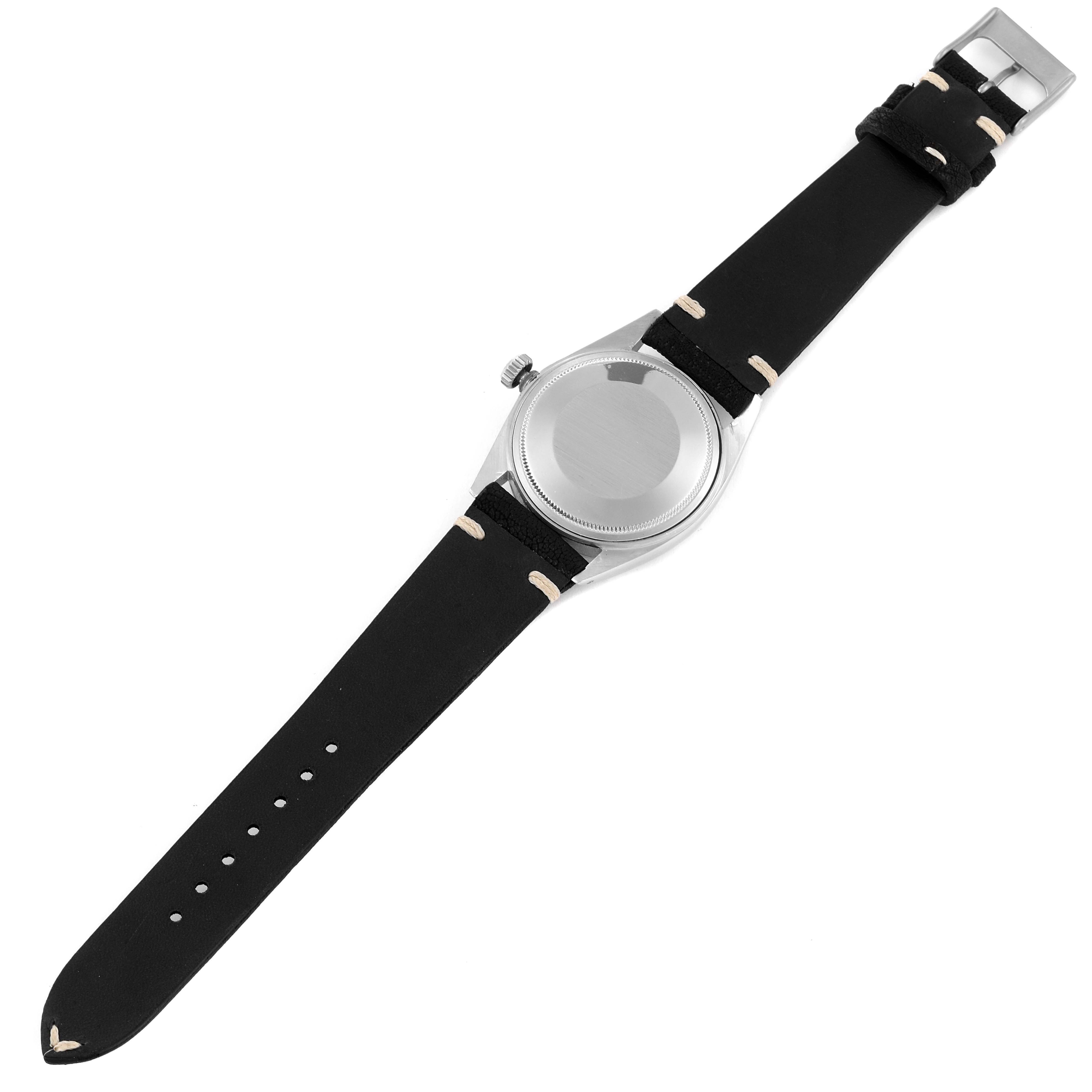 The Rolex Vintage Collection 1601 Men's Stainless Steel Black Dial 1601 Men's Stainless Steel Black Dial watch is shown from the back, displaying its black leather strap and undecorated case back.