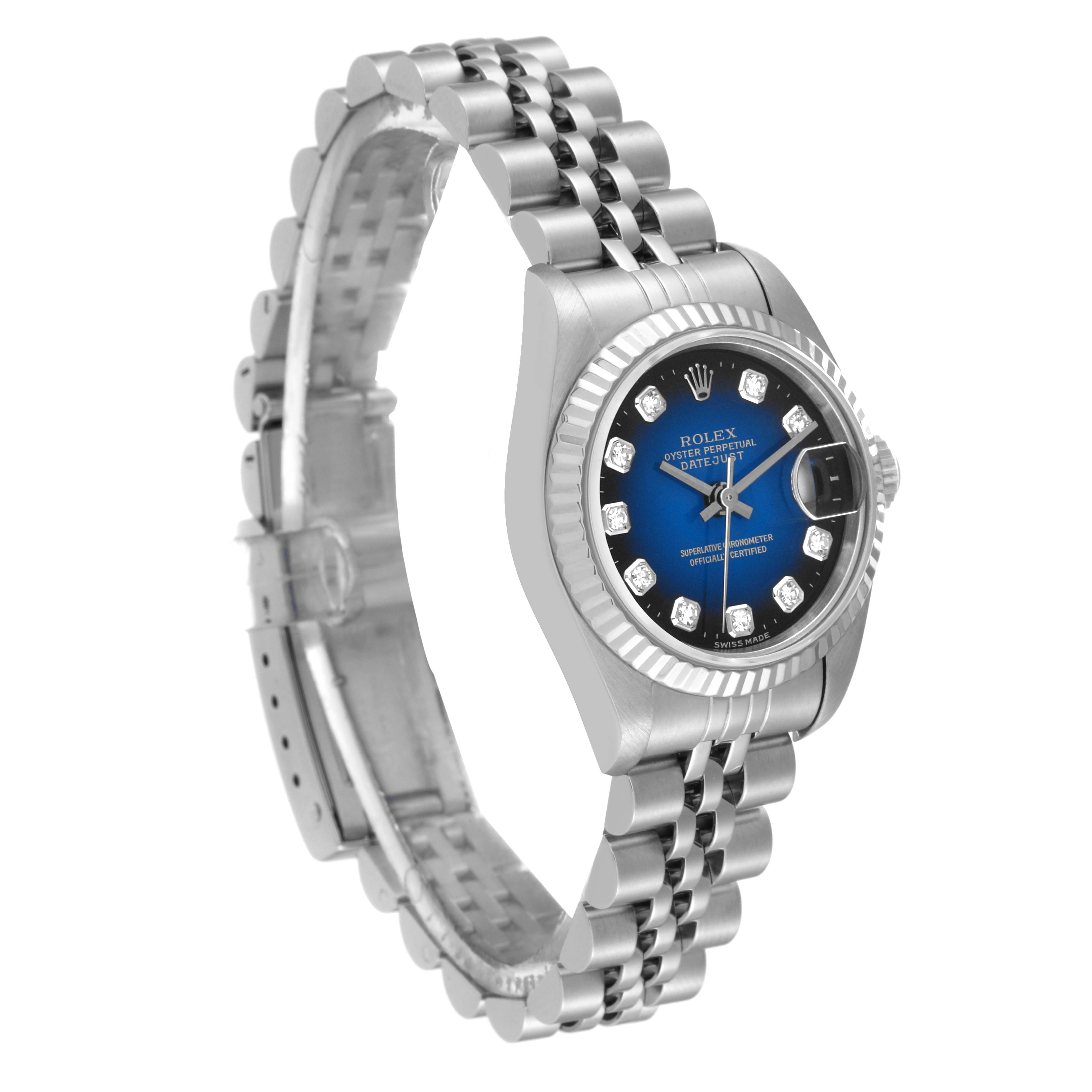 The image shows a Rolex Datejust 69174 Women's Stainless Steel Blue Dial 69174 Women's Stainless Steel Blue Dial watch angled slightly from the side, showcasing its bracelet, bezel, and blue dial with diamond markers.