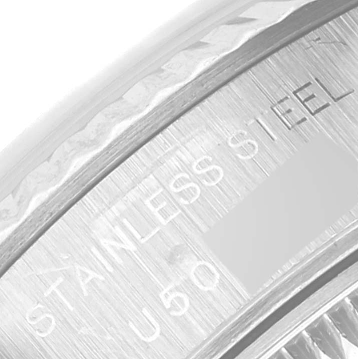 The image shows a close-up of the Rolex Datejust 69174 Women's Stainless Steel Blue Dial 69174 Women's Stainless Steel Blue Dial watch case back with "STAINLESS STEEL" engraving visible.