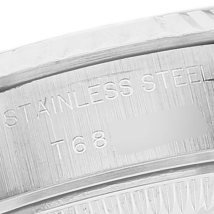 The image shows a close-up of the stainless steel inscription and partial serial number on the casing of a Rolex Datejust 69174 Women's Stainless Steel Silver Dial 69174 Women's Stainless Steel Silver Dial watch.