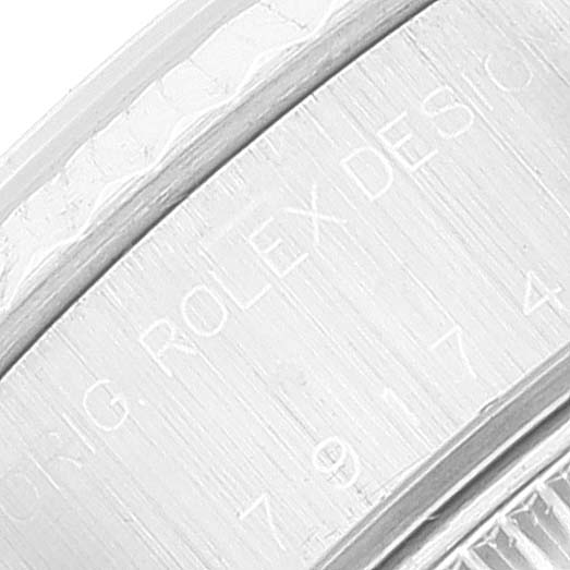 This close-up image shows the engraving on the side of a Rolex Datejust 79174 Women's Stainless Steel Silver Dial 79174 Women's Stainless Steel Silver Dial watch case.