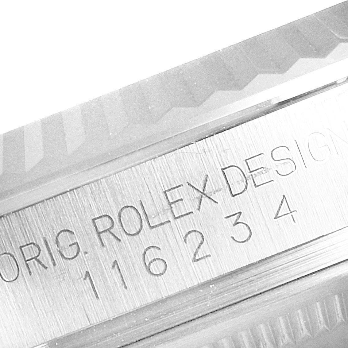The close-up image shows the engraved serial number and part of the bezel of a Rolex Datejust 116234 Men's Stainless Steel Silver Dial 116234 Men's Stainless Steel Silver Dial watch.