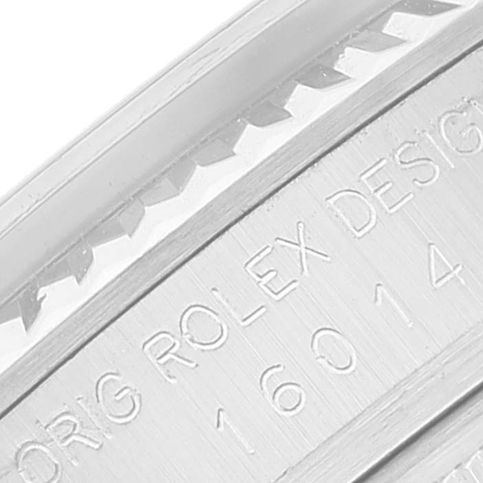 This image shows a close-up of the side engraving on a Vintage Collection model Rolex watch, displaying the serial number and "ORIG ROLEX DESIGN" text.