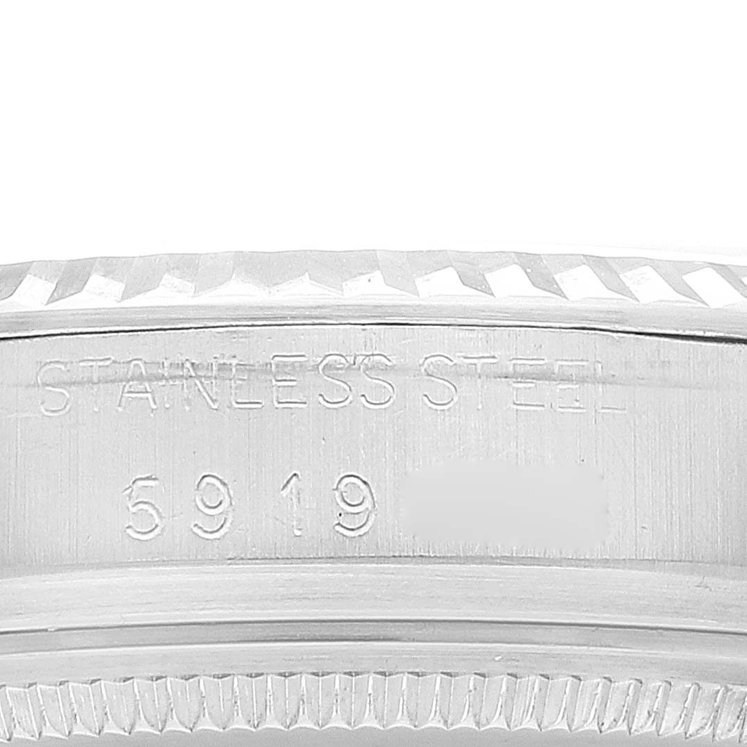 This close-up image shows the engraved stainless steel case side of a Vintage Collection Rolex watch.
