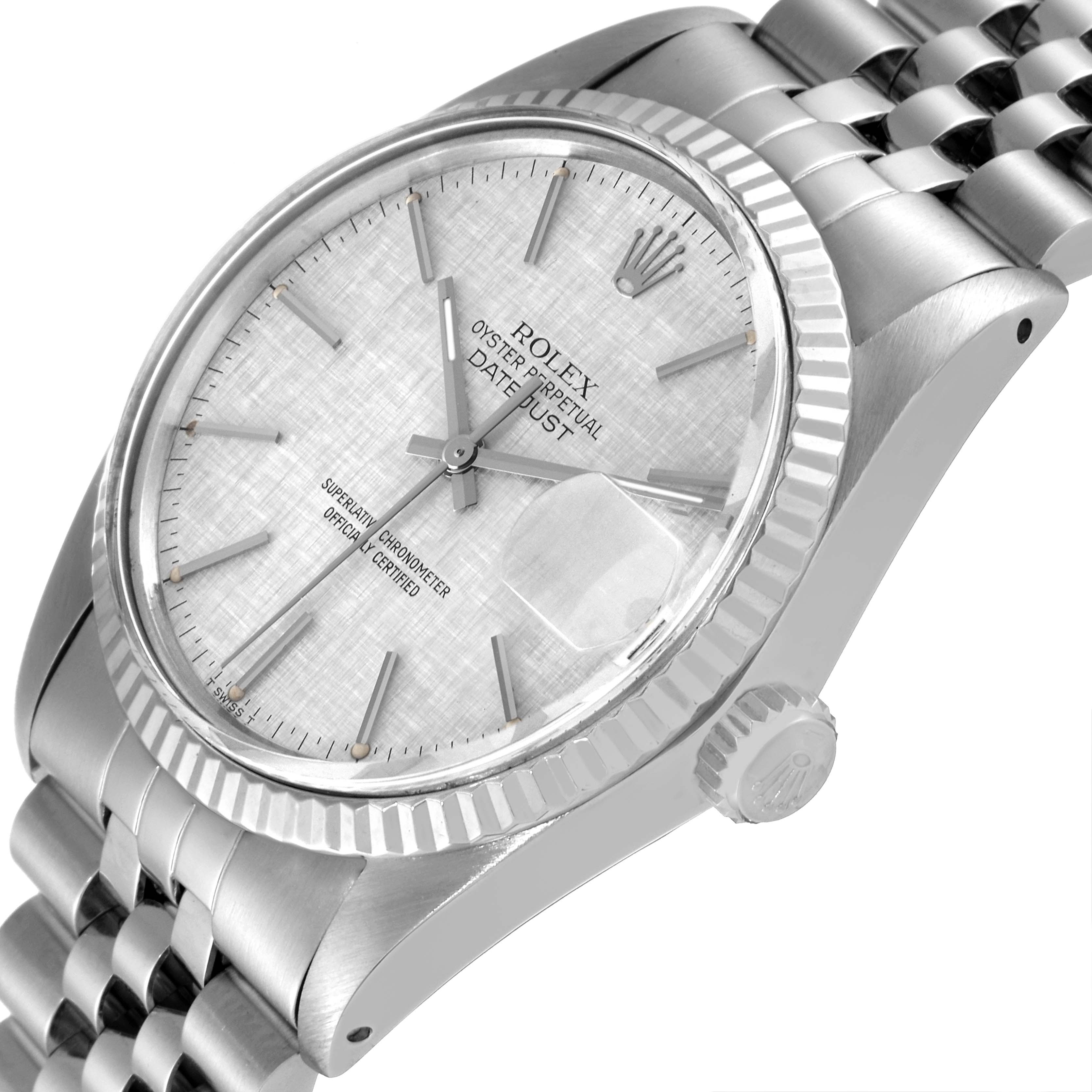 The image shows a close-up of the Rolex Datejust 16014 Men
s Stainless Steel Silver Dial 16014 Men
s Stainless Steel Silver Dial watch from an angle highlighting the face, bezel, crown, and part of the bracelet.
