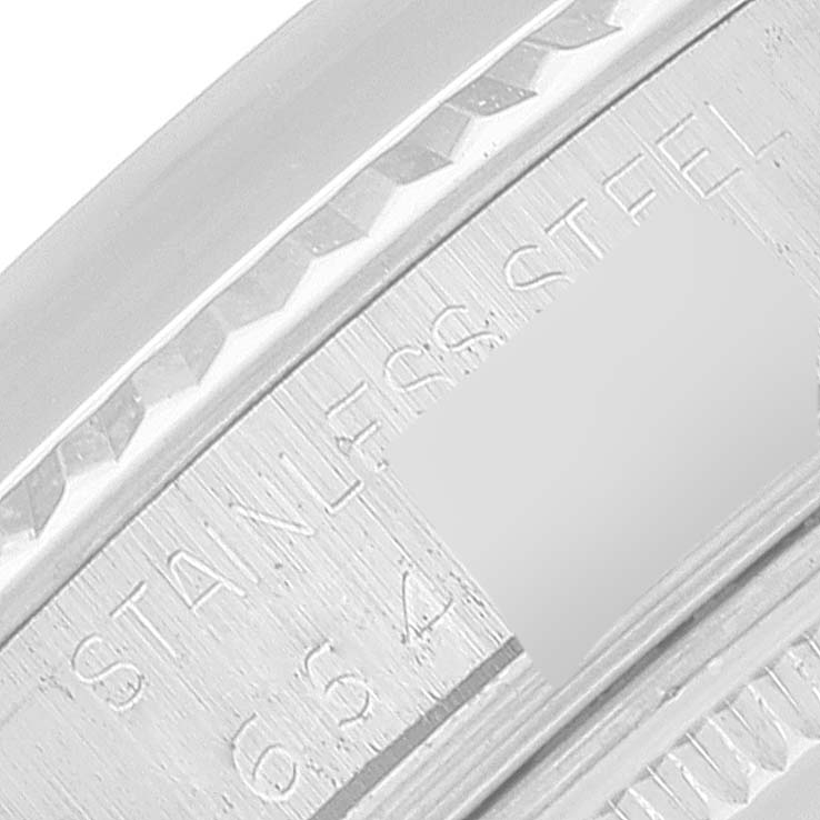 The image shows a close-up of the case side of the Rolex Datejust 16014 Men
s Stainless Steel Silver Dial 16014 Men
s Stainless Steel Silver Dial, with "STAINLESS STEEL" engraved.
