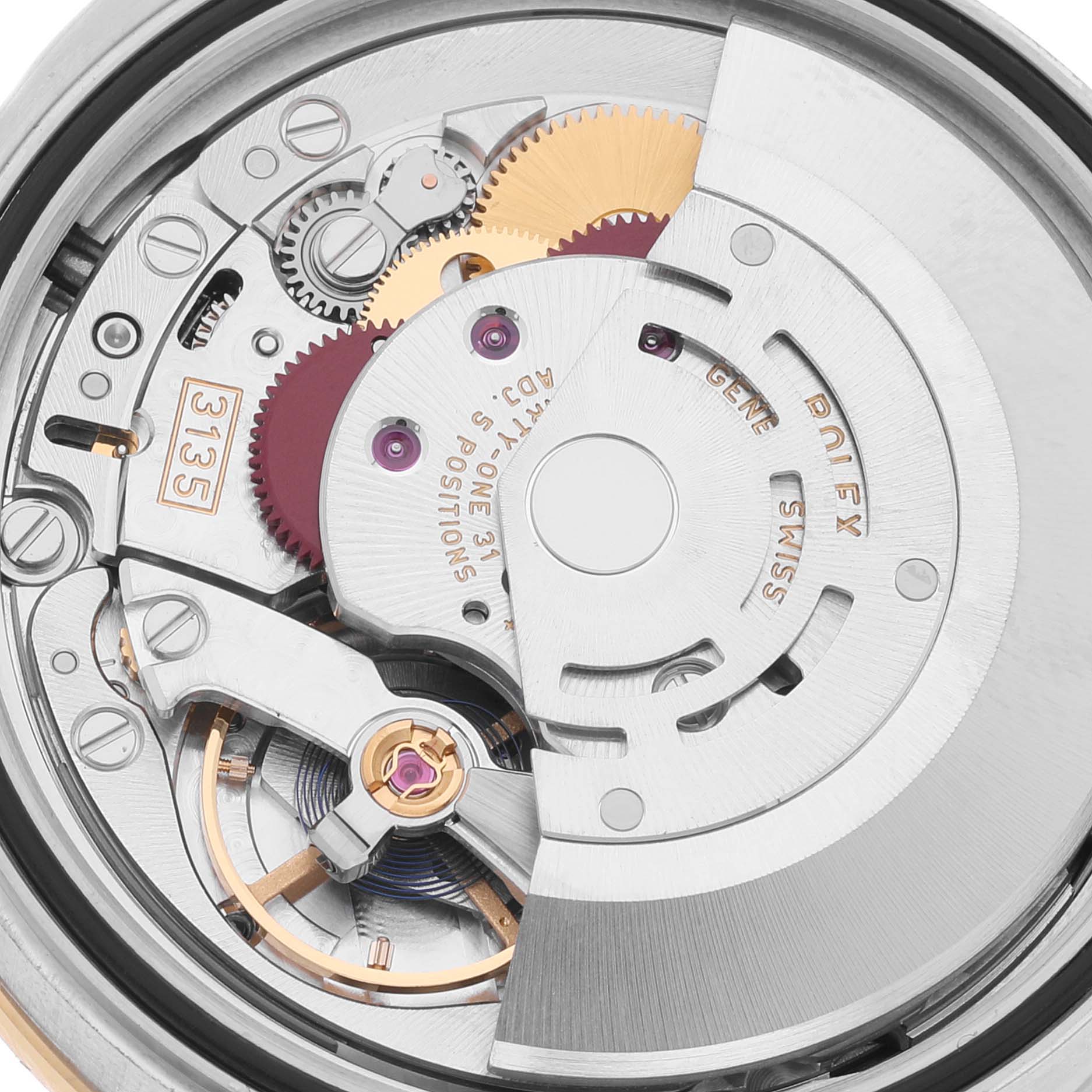 This image shows the Rolex Datejust 116243 Men's Steel and Gold (two tone) Black Dial 116243 Men's Steel and Gold (two tone) Black Dial watch's internal movement components from a close-up angle.