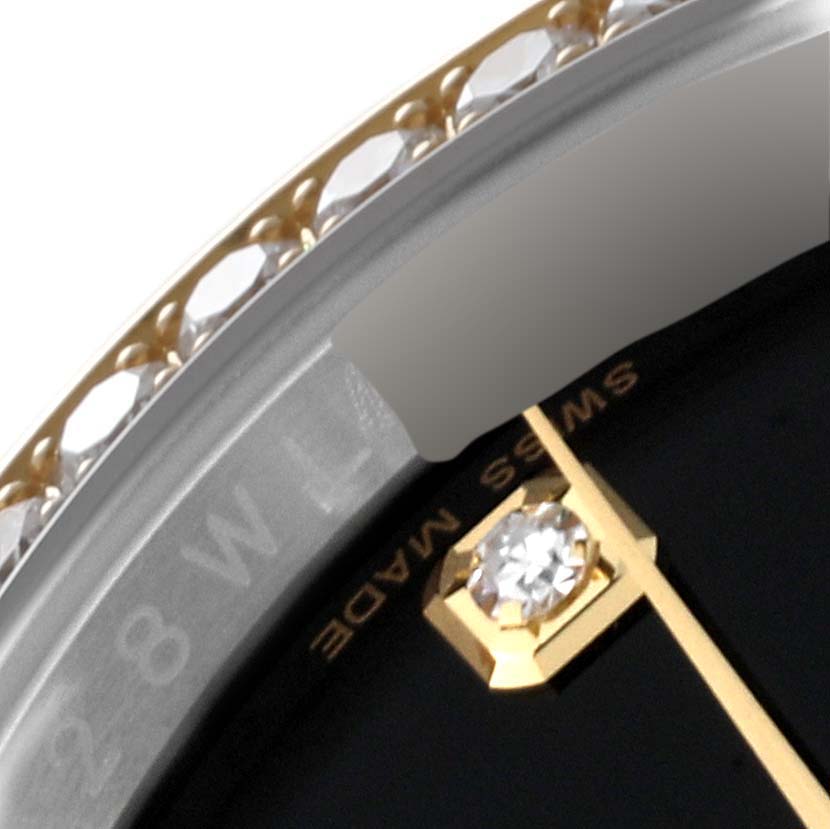 The image shows a close-up of the bezel, part of the dial, and a diamond marker of a Rolex Datejust 116243 Men's Steel and Gold (two tone) Black Dial 116243 Men's Steel and Gold (two tone) Black Dial watch.