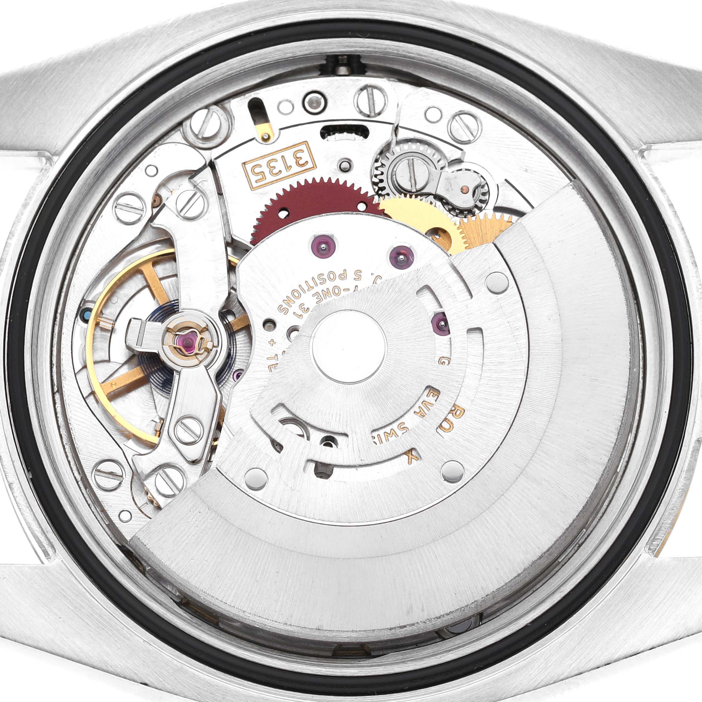 The image shows the movement mechanism of a Rolex Datejust 116233 Men's Steel and Gold (two tone) Champagne Dial watch from the back, highlighting gears and components.