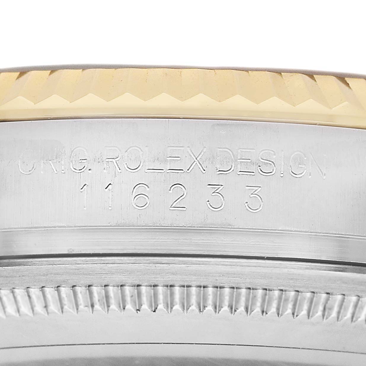 The image shows a close-up of the model number engraving on the side of a Rolex Datejust 116233 Men's Steel and Gold (two tone) Champagne Dial watch case.