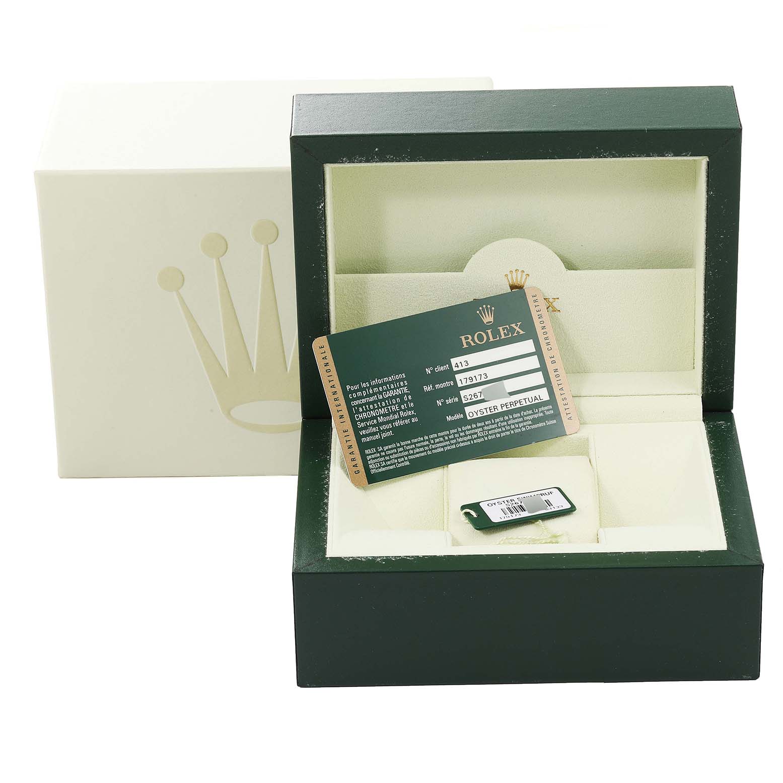 The image shows a Rolex Datejust 179173 Women's Steel and Gold (two tone) Beige Dial 179173 Women's Steel and Gold (two tone) Beige Dial box containing the warranty card and a tag, with the card displayed at an angle.