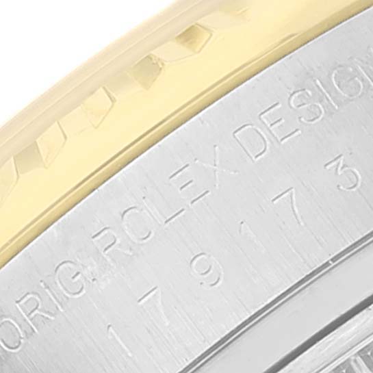 The image shows a close-up of the serial engraving and bezel of a Rolex Datejust 179173 Women's Steel and Gold (two tone) Beige Dial 179173 Women's Steel and Gold (two tone) Beige Dial watch.